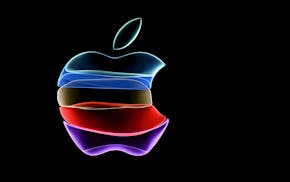 The Apple logo is projected on a screen before the start of a product launch event at Apple's headquarters in Cupertino, California, in 2019.