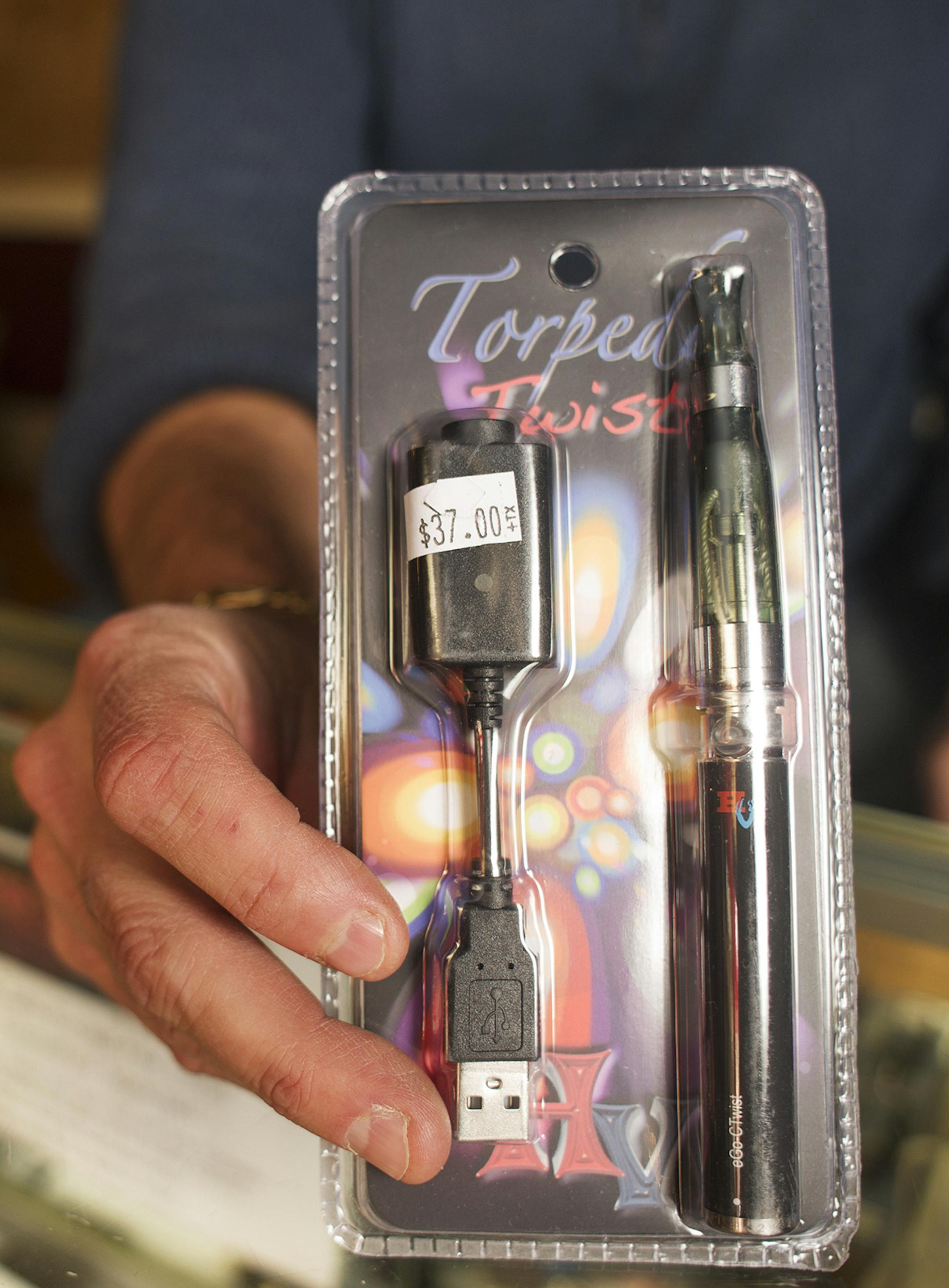 Steve Johnson displays a Torpedo Twist electronic cigarette at his Anoka, MN tobacco shop, Little Havana, Thursday, November 7th, 2013. ] (Matthew Hintz, Anoka, 110713)