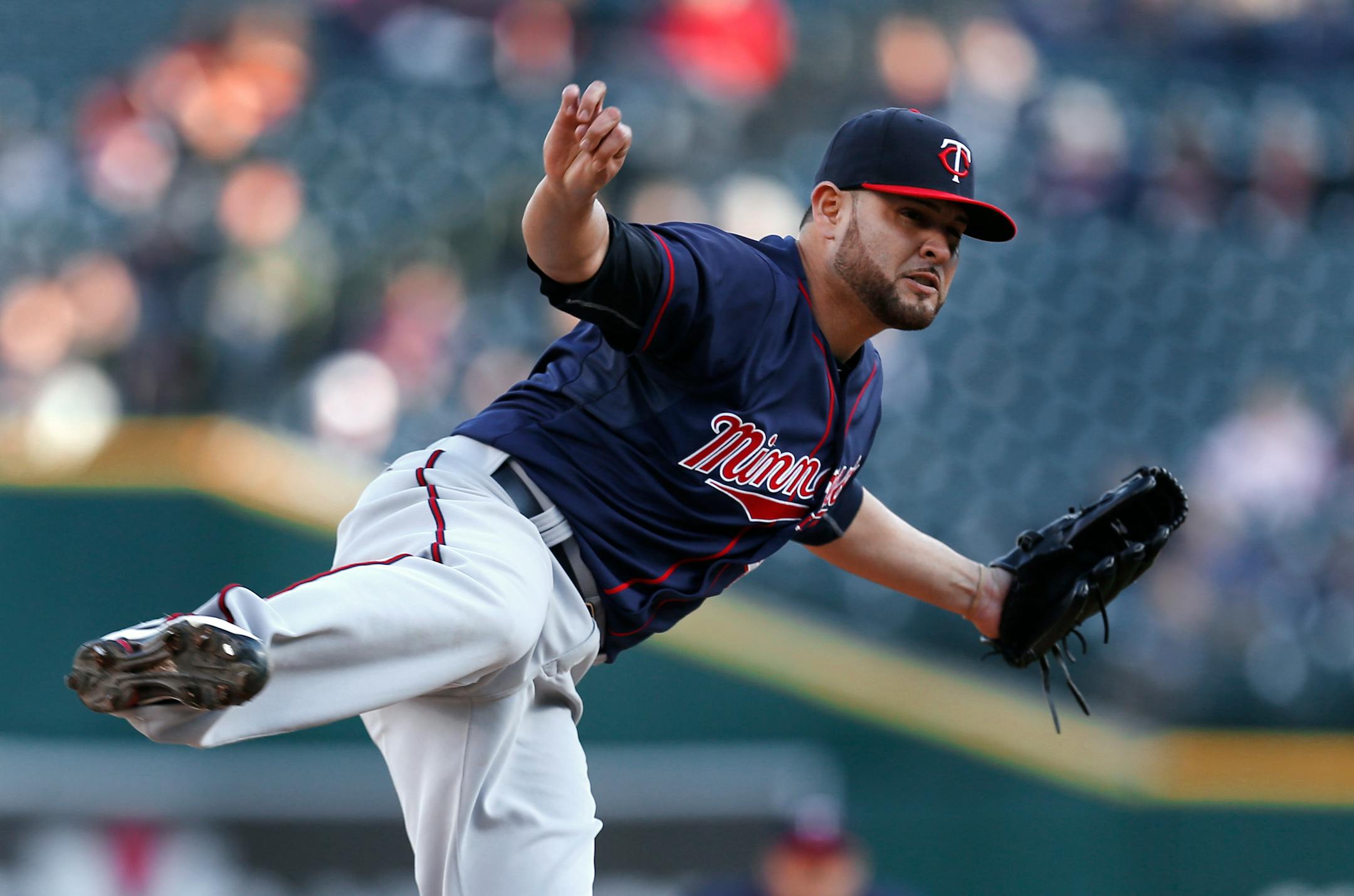 Minnesota Twins pitcher Ricky Nolasco watches a delivery to the Detroit Tigers during the first inning of a baseball game in Detroit on Wednesday, May 13, 2015. (AP Photo/Paul Sancya)
