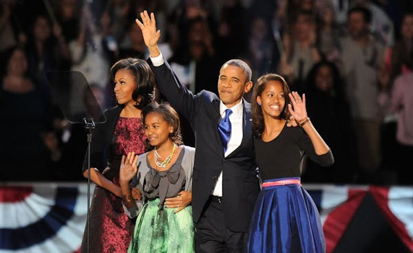 President Barack Obama and the first family take the stage early Wednesday morning in Chicago.