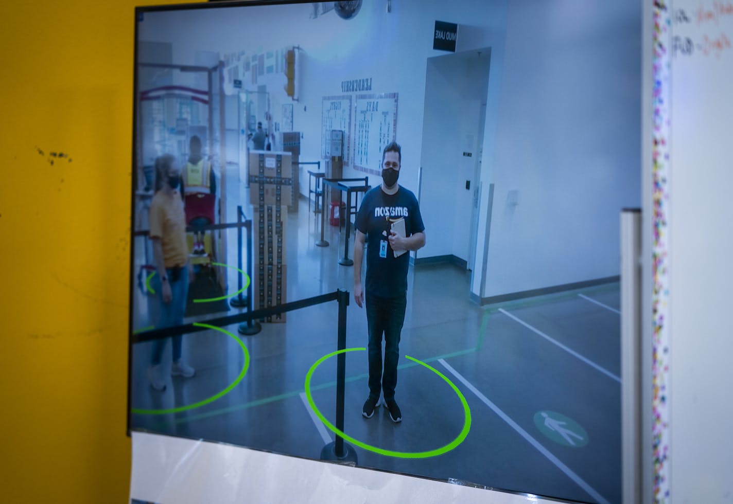 A video screen that reminded employees to be socially distant at Amazon's Shakopee fulfillment center. ] LEILA NAVIDI • leila.navidi@startribune.com BACKGROUND INFORMATION: Amazon's Shakopee fulfillment center on Thursday, October 8, 2020.