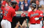 Cleveland's Roberto Perez, right, is congratulated by Franmil Reyes after hitting a three-run home run in the sixth inning