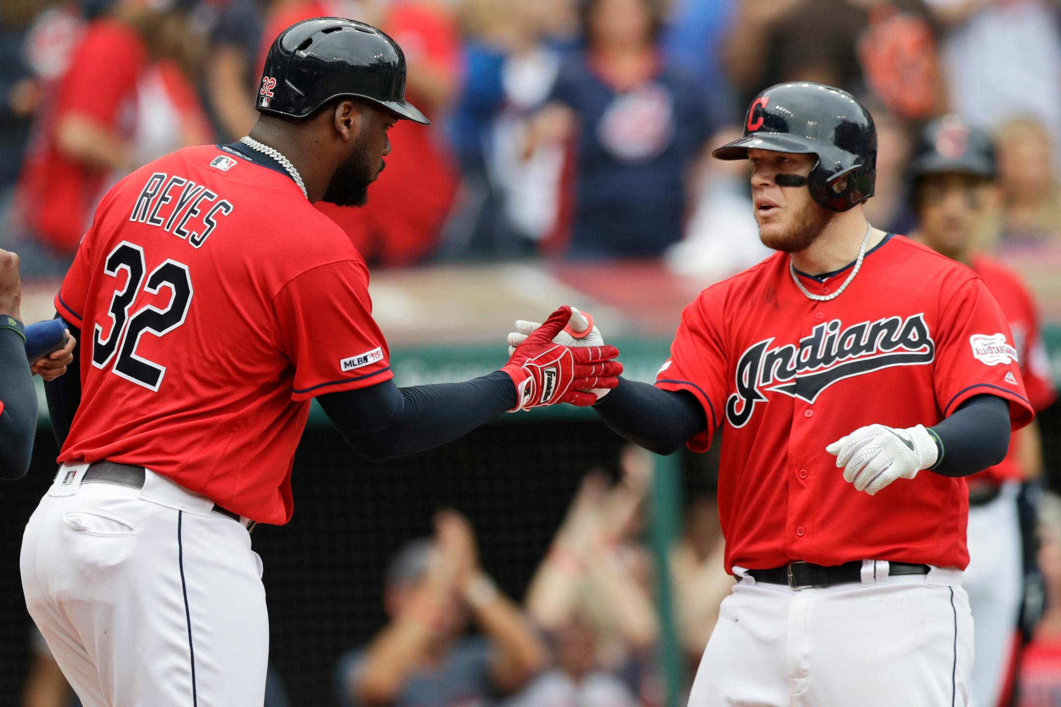 Cleveland's Roberto Perez, right, is congratulated by Franmil Reyes after hitting a three-run home run in the sixth inning