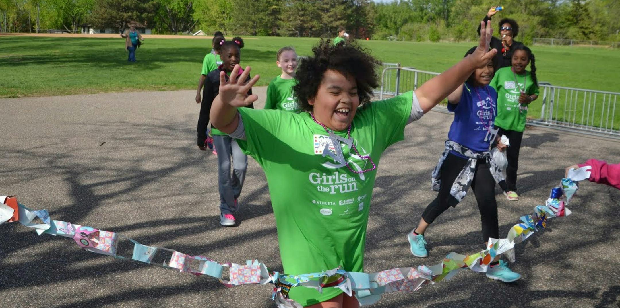 A runner crossed the finish line at the Girls on the Run practice 5K.
