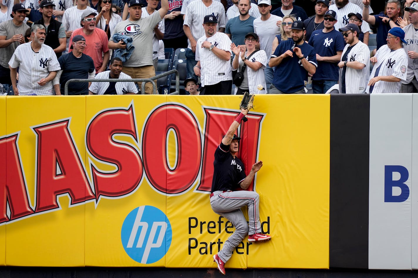 Minnesota Twins right fielder Max Kepler (26) misses the catch on a solo home run by New York Yankees' DJ LeMahieu in the sixth inning of a baseball game, Sunday, April 16, 2023, in New York. (AP Photo/John Minchillo)