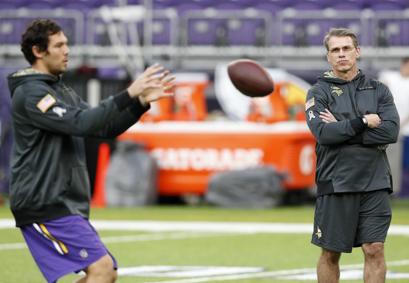 Minnesota Vikings general manager Rick Spielman and quarterback Sam Bradford.