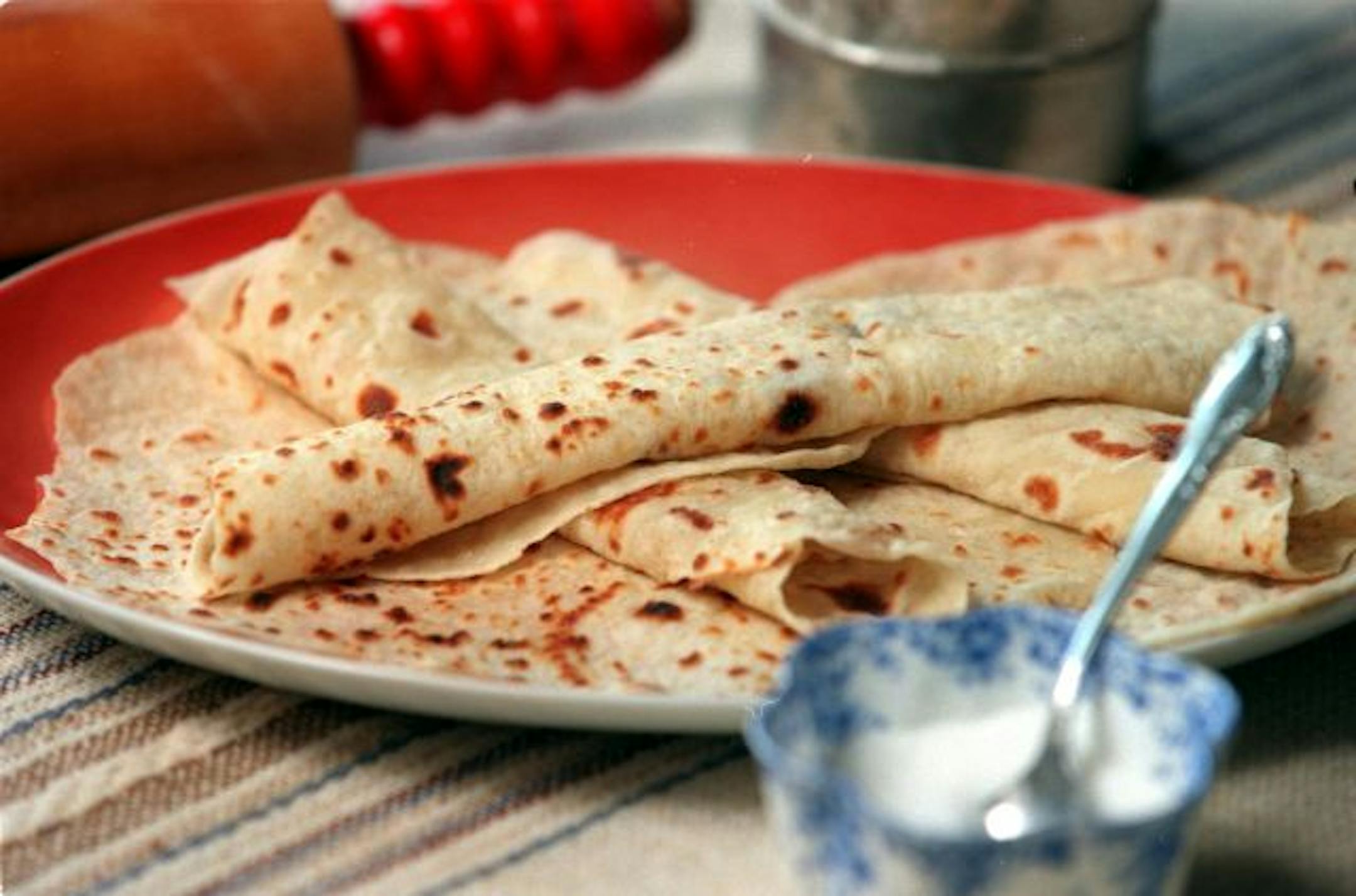 Taste - making lefse -- lefse.14775 - plate of finished lefse, ofeten served with butter and sugar