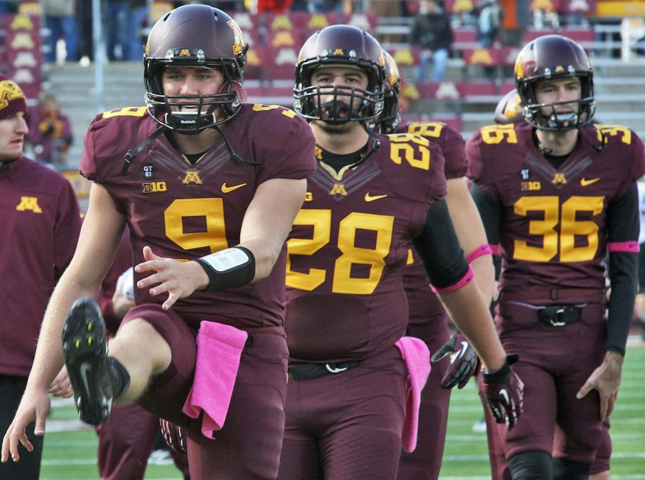Minnesota Gophers vs. Purdue Boilermakers football. Minnesota players, including starting quarterback Philip Nelson (9), stretched out before the start of the game. (MARLIN LEVISON/STARTRIBUNE(mlevison@startribune.com