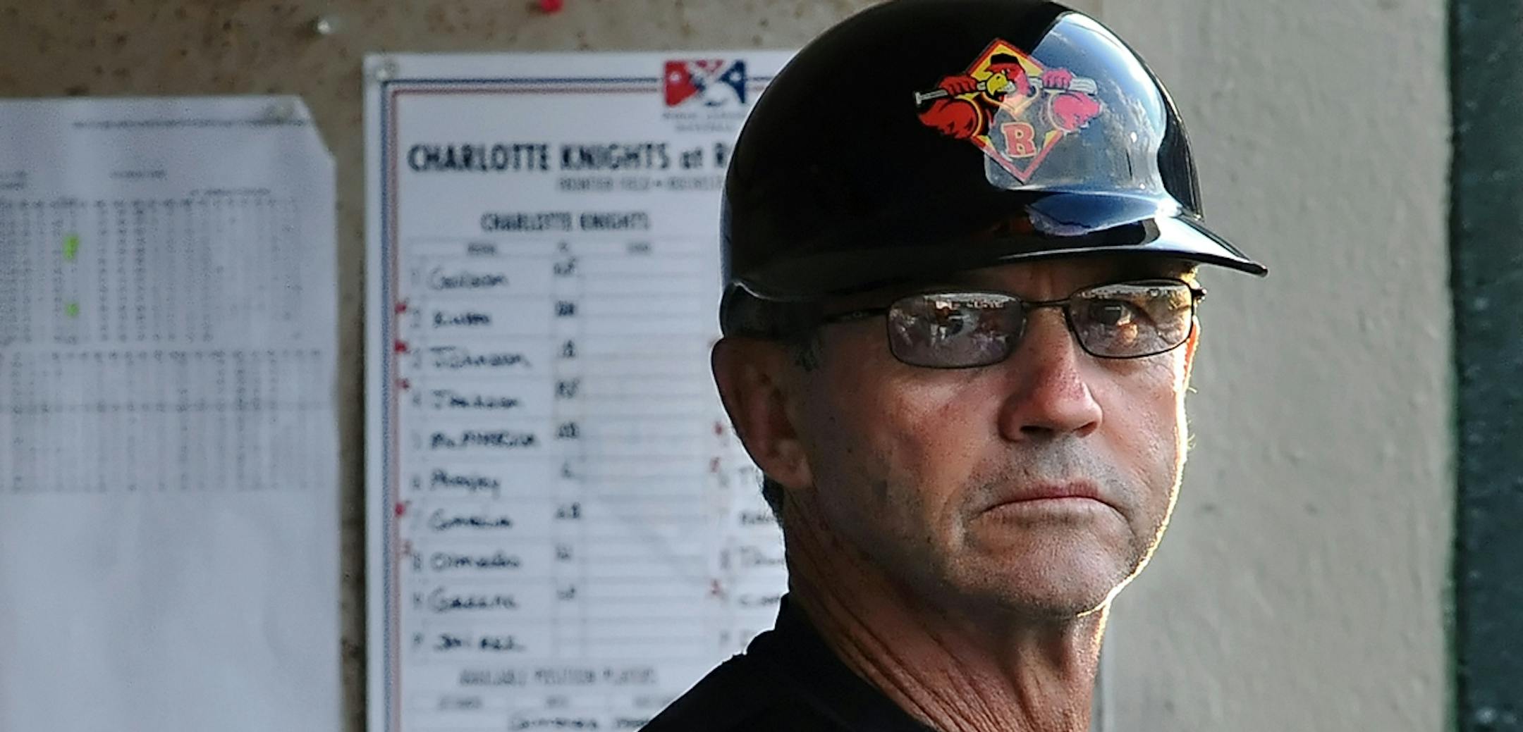 Rochester Red Wings' manager Gene Glynn watches from the dugout during game against the Charlotte Knights at Frontier Field on Monday, June 25, 2012.