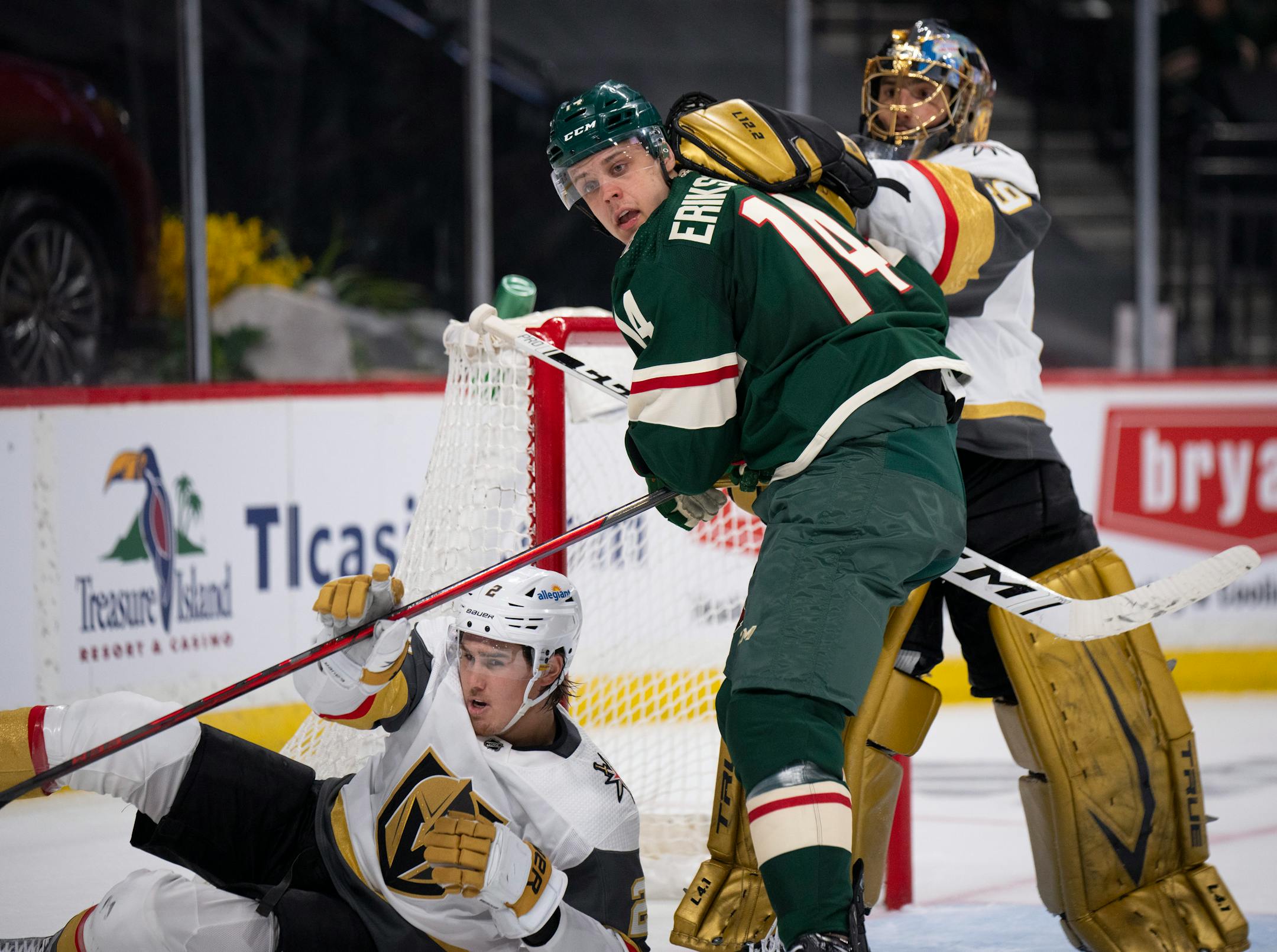 Vegas Golden Knights defenseman Zach Whitecloud (2) and Vegas Golden Knights goaltender Marc-Andre Fleury (29) both antagonized Minnesota Wild center Joel Eriksson Ek (14) in the second period.