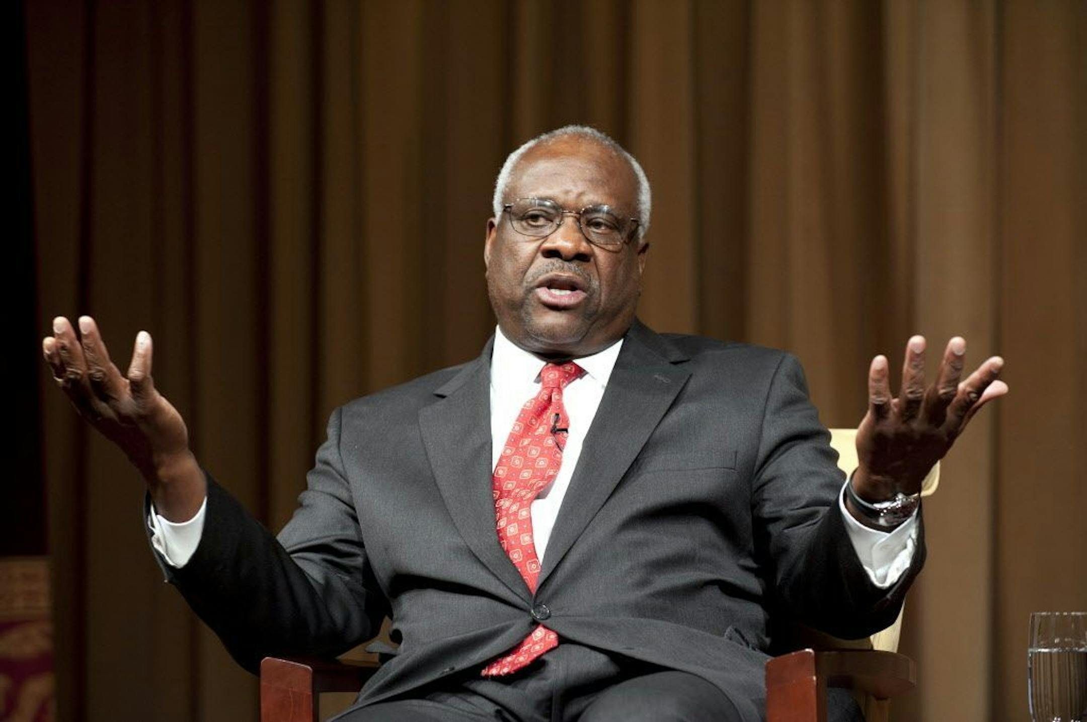 FILE -- Supreme Court Justice Clarence Thomas at the National Archives in Washington, Sept. 12, 2012. Justice Clarence Thomas might have more to say in writing than in arguments in February 2014 when the Supreme Court considers overruling a 1988 securities-fraud decision. (Margot Schulman/National Archives) -- FOR EDITORIAL USE ONLY.