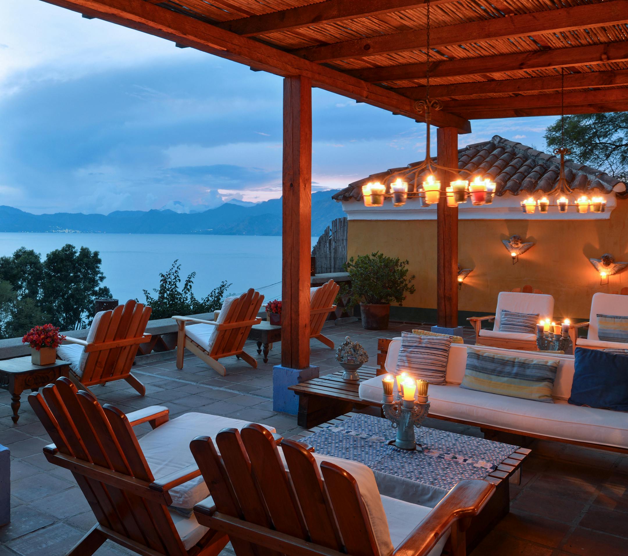 In an undated handout photo, the terrace at Casa Palopo overlooking Lake Atitlan and the Toliman, Atitlan and San Pedro volcanoes in Guatemala. Resorts in Cambodia, Thailand, Costa Rica and Guatemala are offering packages and lower prices in what is sometimes called the green season. (Casa Palopo via The New York Times) — NO SALES; FOR EDITORIAL USE ONLY WITH CHICAGO RESTAURANT ADV17 BY JAMIE FELDMAR FOR SEPT. 17, 2017. ALL OTHER USE PROHIBITED.