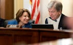 Senate Rules and Administration oversight Chair Sen. Amy Klobuchar, D-Minn., left, speaks with Sen. Roy Blunt, R-Mo., during a hearing to examine the 