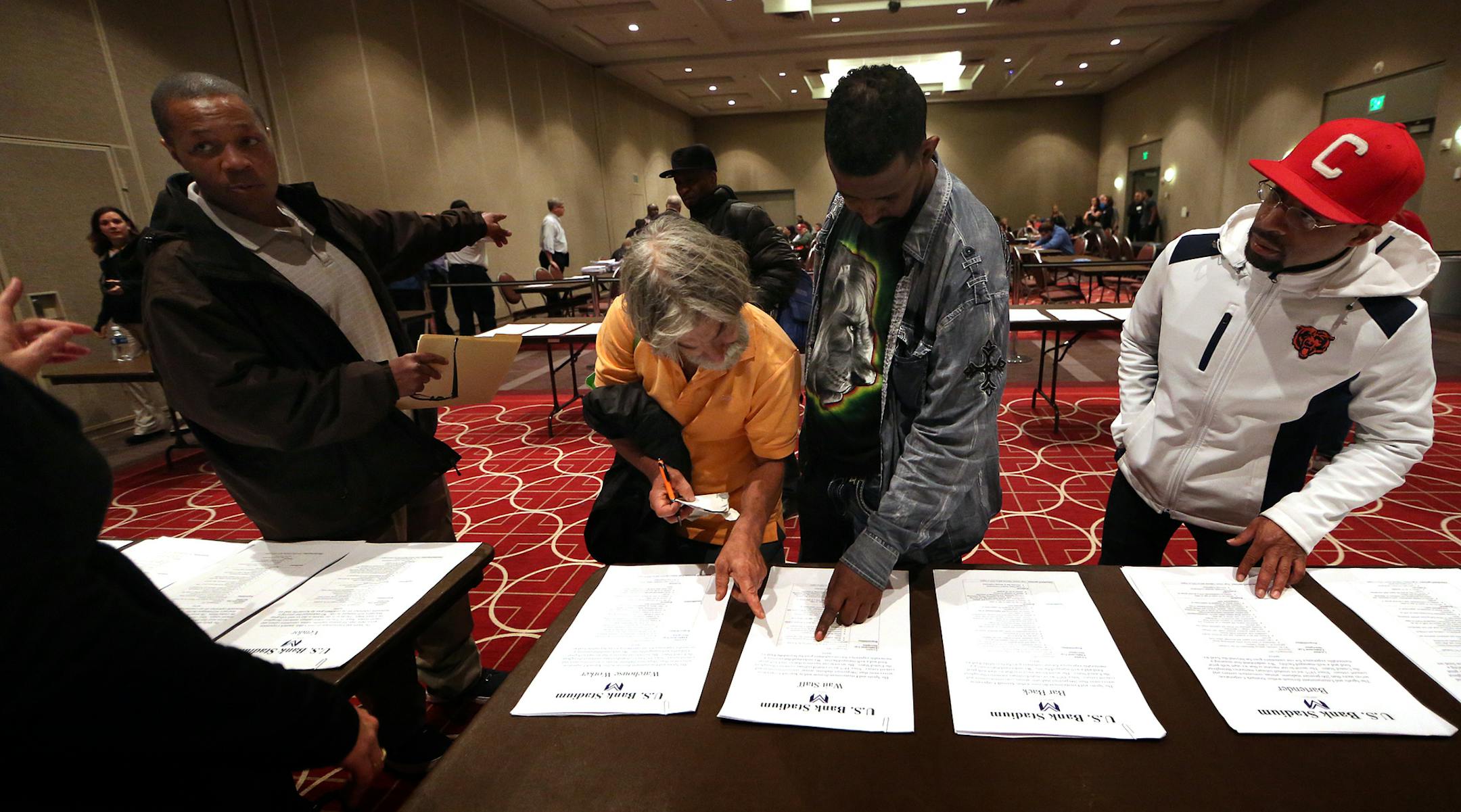 Job descriptions were set on a table for those who had not previously submitted an application. ] JIM GEHRZ ï james.gehrz@startribune.com / Minneapolis, MN / April 27, 2016 /9:00 AM ñ BACKGROUND INFORMATION: People came to a hiring fair at the Minneapolis Convention Center Tuesday for a chance to land one of the more than 2,500 jobs available at U.S. Bank Stadium. The first job fair opens at 9 a.m. for the new U.S. Bank Stadium. They are looking to fill 2,500 jobs. The event is at the