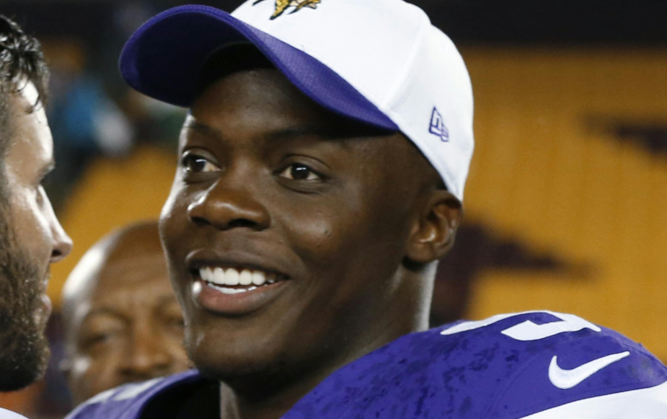 Oakland Raiders quarterback Christian Ponder (9) talks with Minnesota Vikings quarterback Teddy Bridgewater after a preseason NFL football game, Saturday, Aug. 22, 2015, in Minneapolis. The Vikings defeated the Raiders 20-12. (AP Photo/Jim Mone)