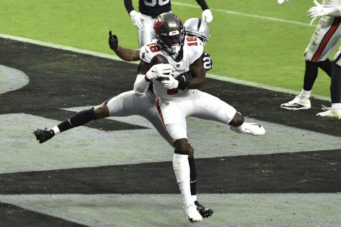 Tampa Bay Buccaneers wide receiver Tyler Johnson (18) catches a touchdown pass Sunday vs. Las Vegas.