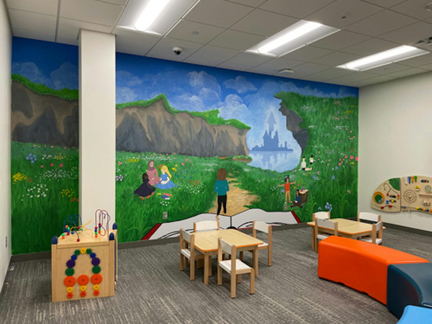 A group of Shakopee high school students painted a mural inside the children's waiting room of the Health and Human Services Department at the Scott County Government center. Photo provided by Scott County and Shakopee Public Schools.