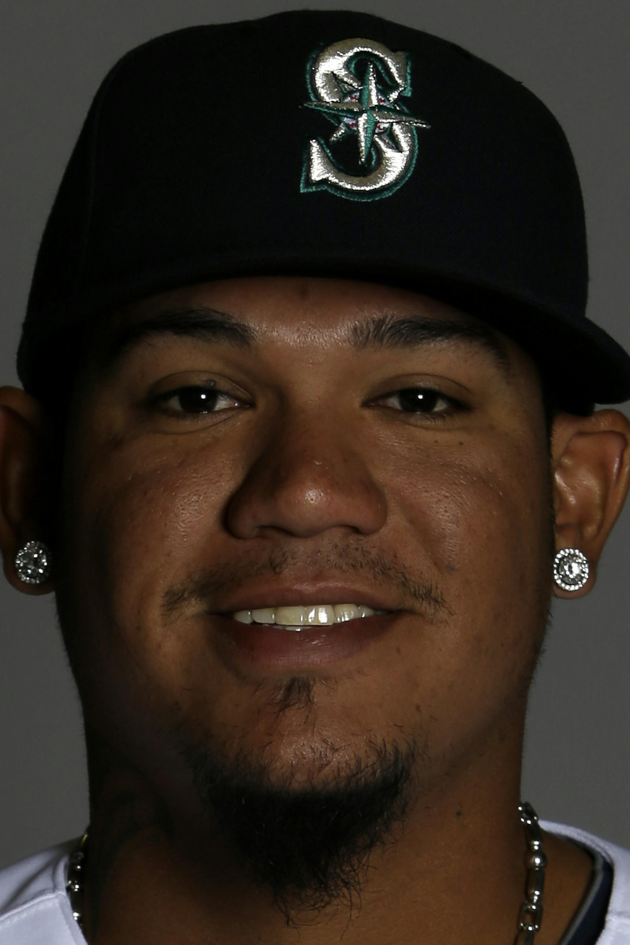 This is a 2014 photo of pitcher Felix Hernandez of the Seattle Mariners baseball team. This image reflects the Mariners active roster as of Thursday, Feb. 20, 2014, when this image was taken. (AP Photo/Tony Gutierrez) ORG XMIT: NYOTK