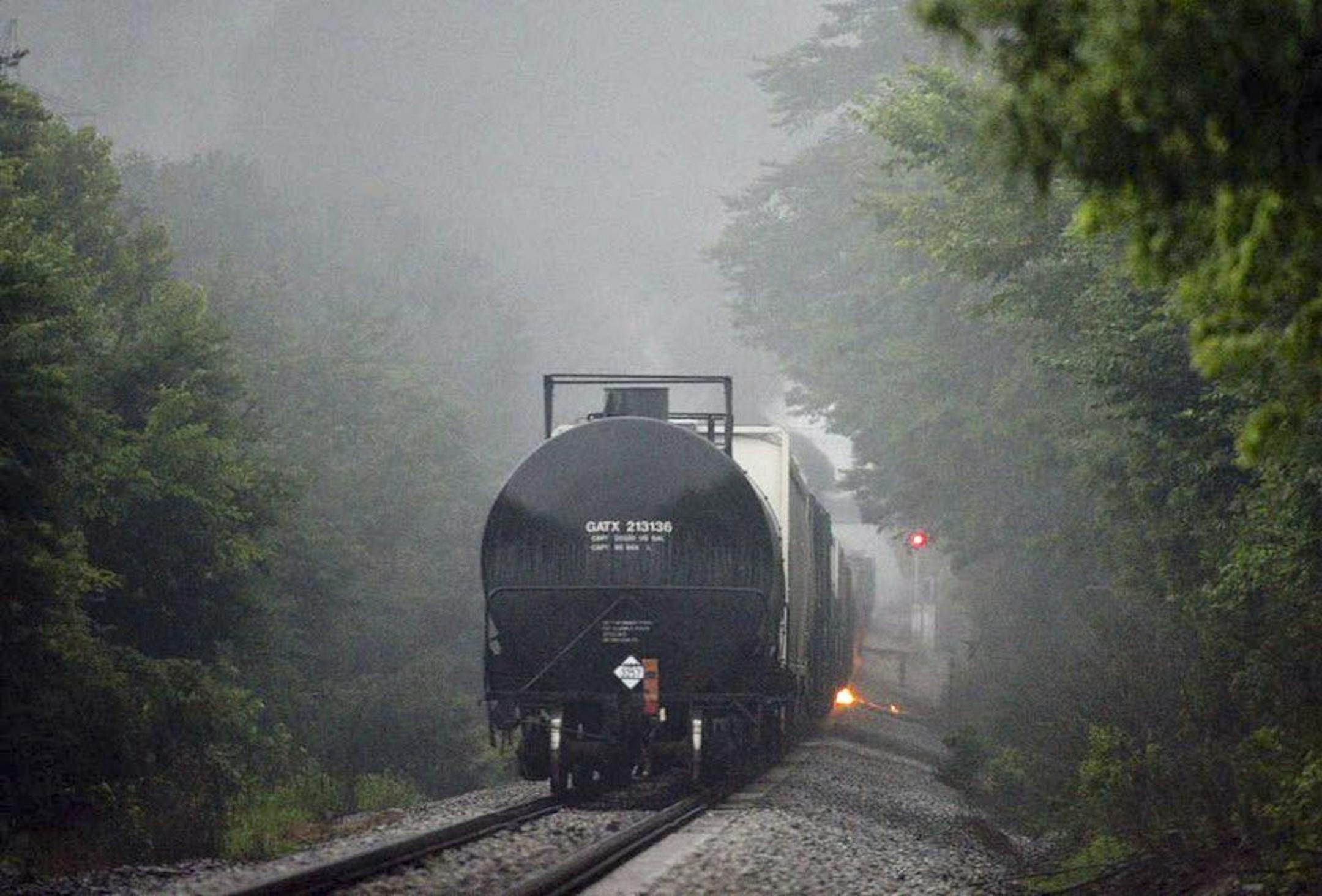 Flames are shown coming from a CSX train carrying flammable and toxic gas in Maryville, Tenn., Thursday, July 2, 2015. A car on the CSX train derailed and caught fire in eastern Tennessee, prompting the evacuation of thousands of people within a 2-mile radius.