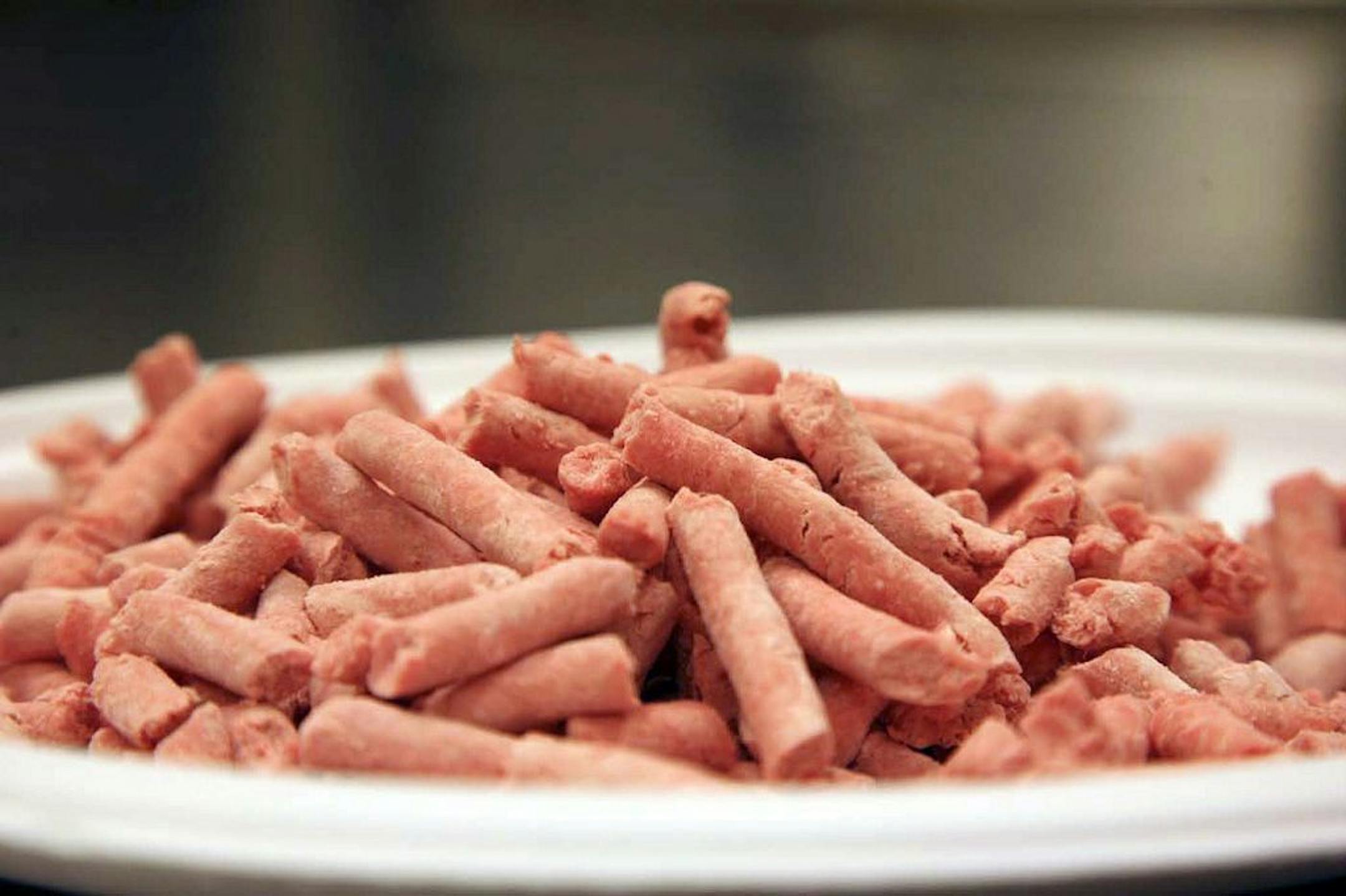 In this undated image released by Beef Products Inc., boneless lean beef trimmings are shown before packaging. The debate over �pink slime� in chopped beef is hitting critical mass. The term, adopted by opponents of �lean finely textured beef,� describes the processed trimmings cleansed with ammonia and commonly mixed into ground meat. Federal regulators say it meets standards for food safety. Critics liken it to pet food _ and their battle has suddenly gone viral amid new media attention and a