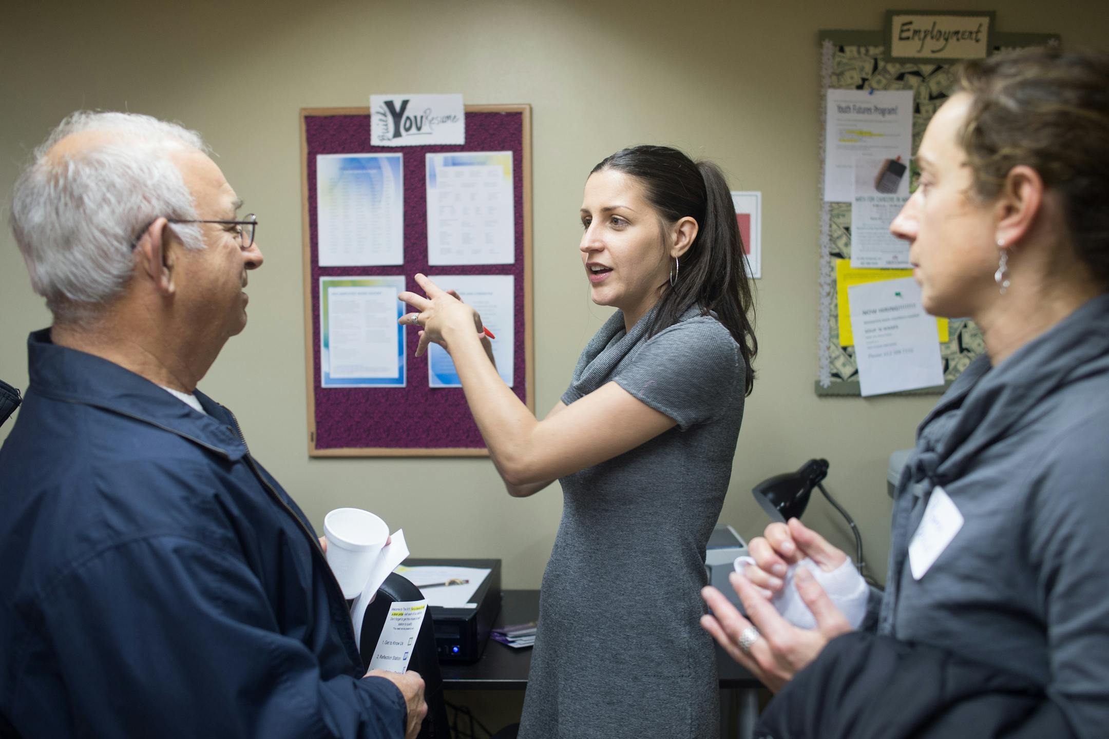 Teens Alone housing case manager Sarah Klouda (cq), center, speaks with Arnie Blatt (cq) and his daughter, Karen Benchuk (cq), during The 915's grand opening Thursday night. ] AARON LAVINSKY • aaron.lavinsky@startribune.com Teens Alone, an organization which serves homeless teens in the West Metro, held its grand opening of The 915, a drop-in center on Mainstreet, Thursday, October 30, 2014 in Hopkins. Karen Benchuk's (cq) daughter is on The 915's youth advisory board so she wanted to see
