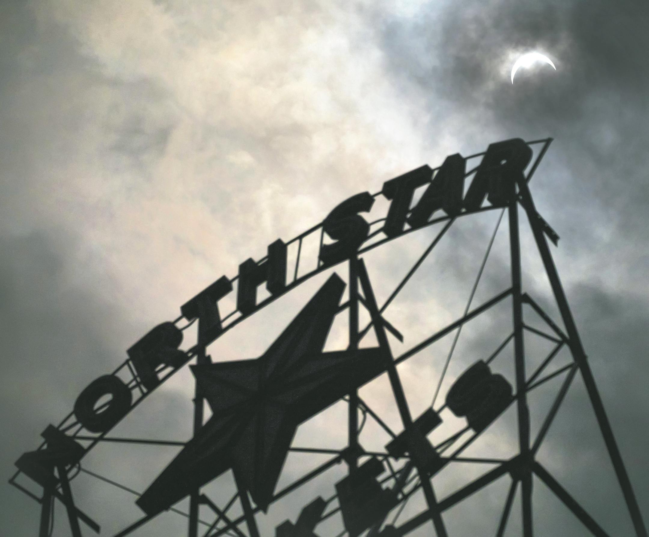 This photo shows a partial eclipse of the sun from downtown Minneapolis, Monday, Aug. 21, 2017. (Brian Peterson/Star Tribune via AP)