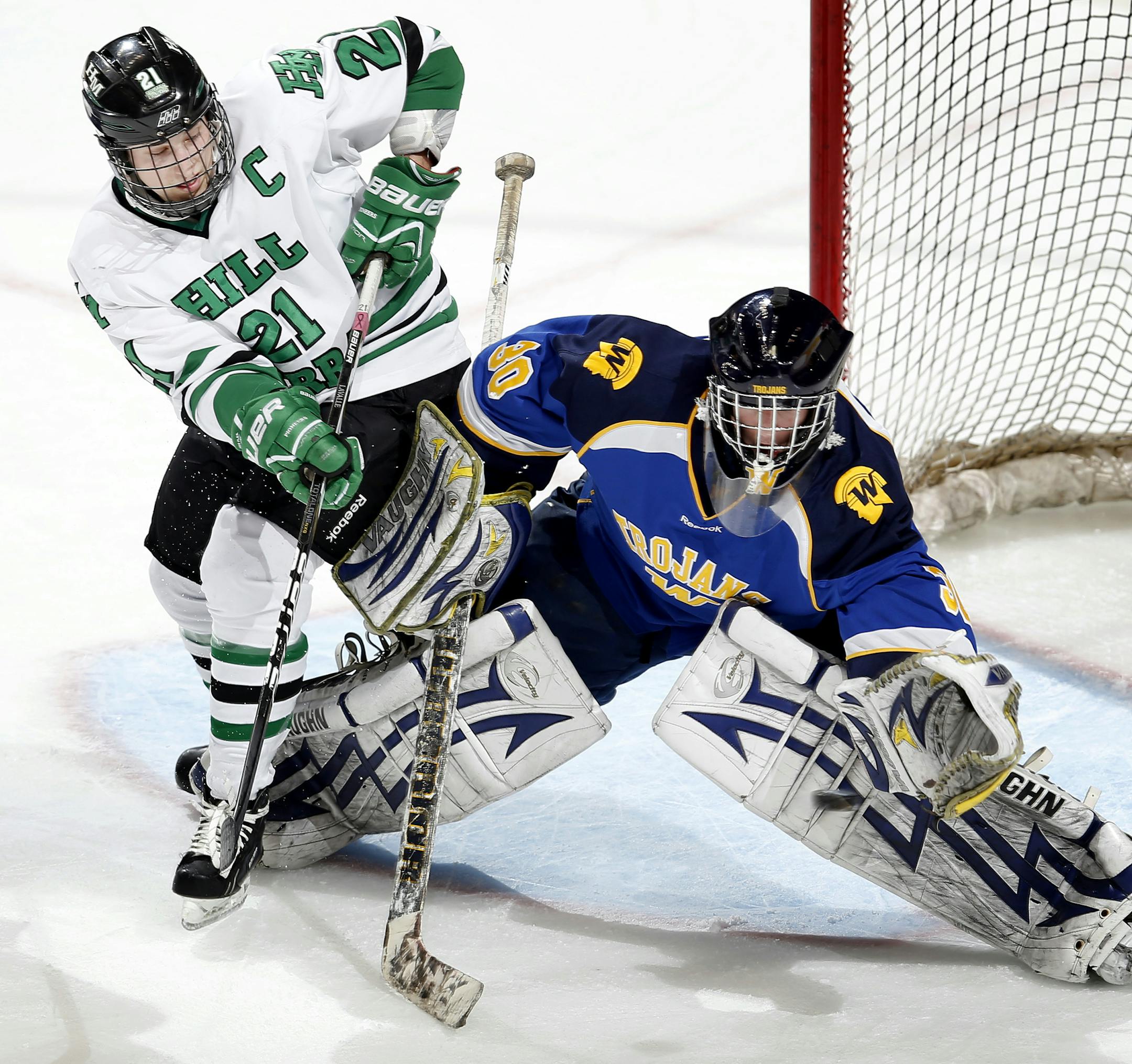 Zach LaValle (21) of Hill-Murray and tangled up with Wayzata goalie Aaron Dingmann (30) in the second period. Hill Murray beat Wayzata by a final score of 2-1. ] CARLOS GONZALEZ cgonzalez@startribune.com - March 8, 2013, St. Paul, Minn., Xcel Energy Center, Minnesota High School Boys State Hockey, 2A Semi Finals, Hill Murray vs. Wayzata ORG XMIT: MIN1303082337554034