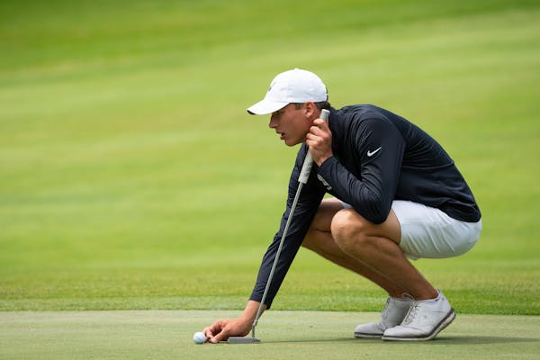 Torger Ohe of Edina lines up a putt at the final hole Wednesday before winning the Class 3A title.



The Class 3A state golf championship was held at