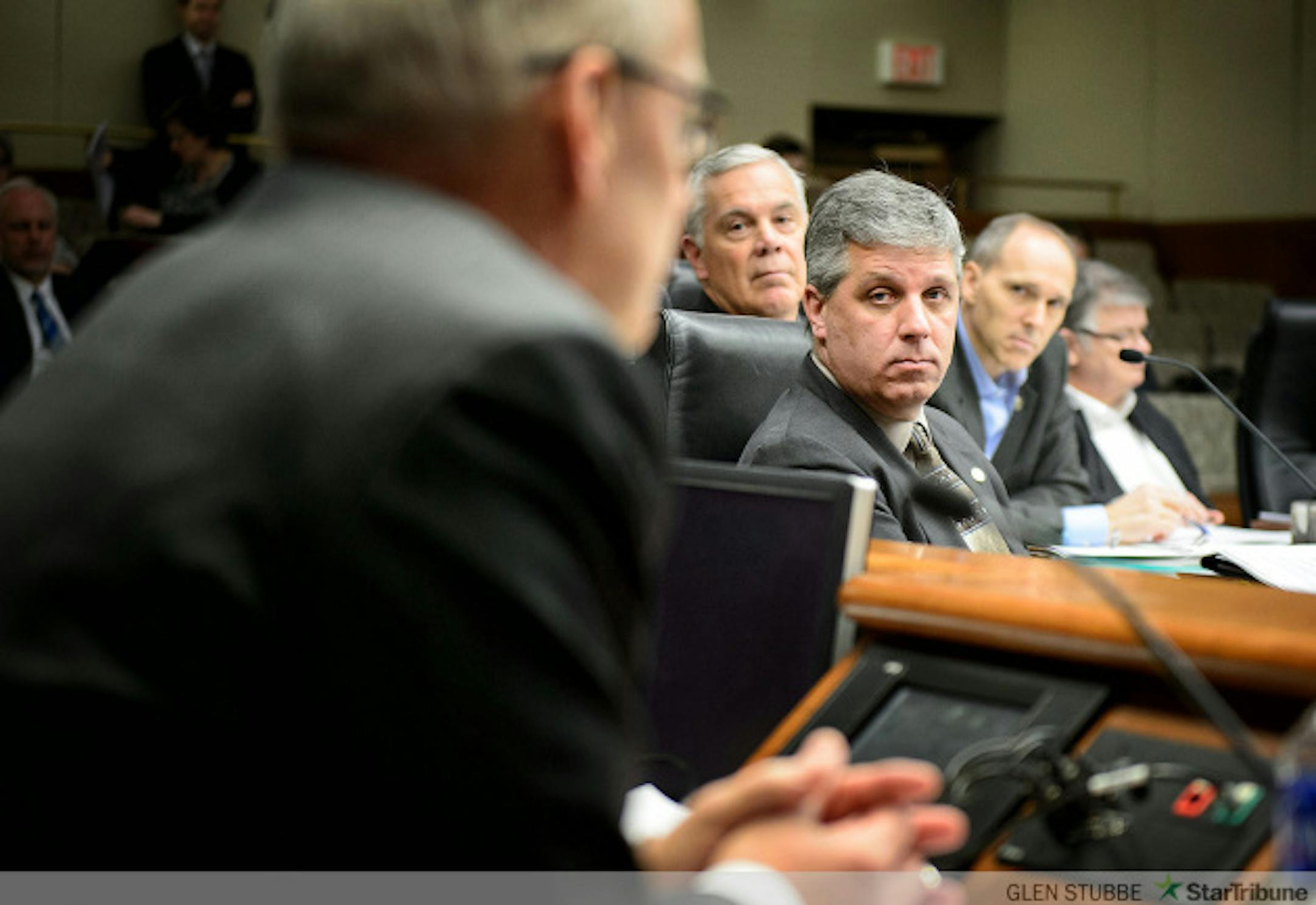 Minnesota Management and Budget Commissioner Myron Frans faced tough questioning from Rep. Steve Drazkowski, center, at the House Ways and Means Committee hearing about Governor Dayton's raises for commissioners.    The committee approved Drazkowski's amendment that would reduce deficiency funding for state agencies by the amount of the raises approved for the commissioners of those agencies.       ] GLEN STUBBE * gstubbe@startribune.com Monday, February 9, 2015