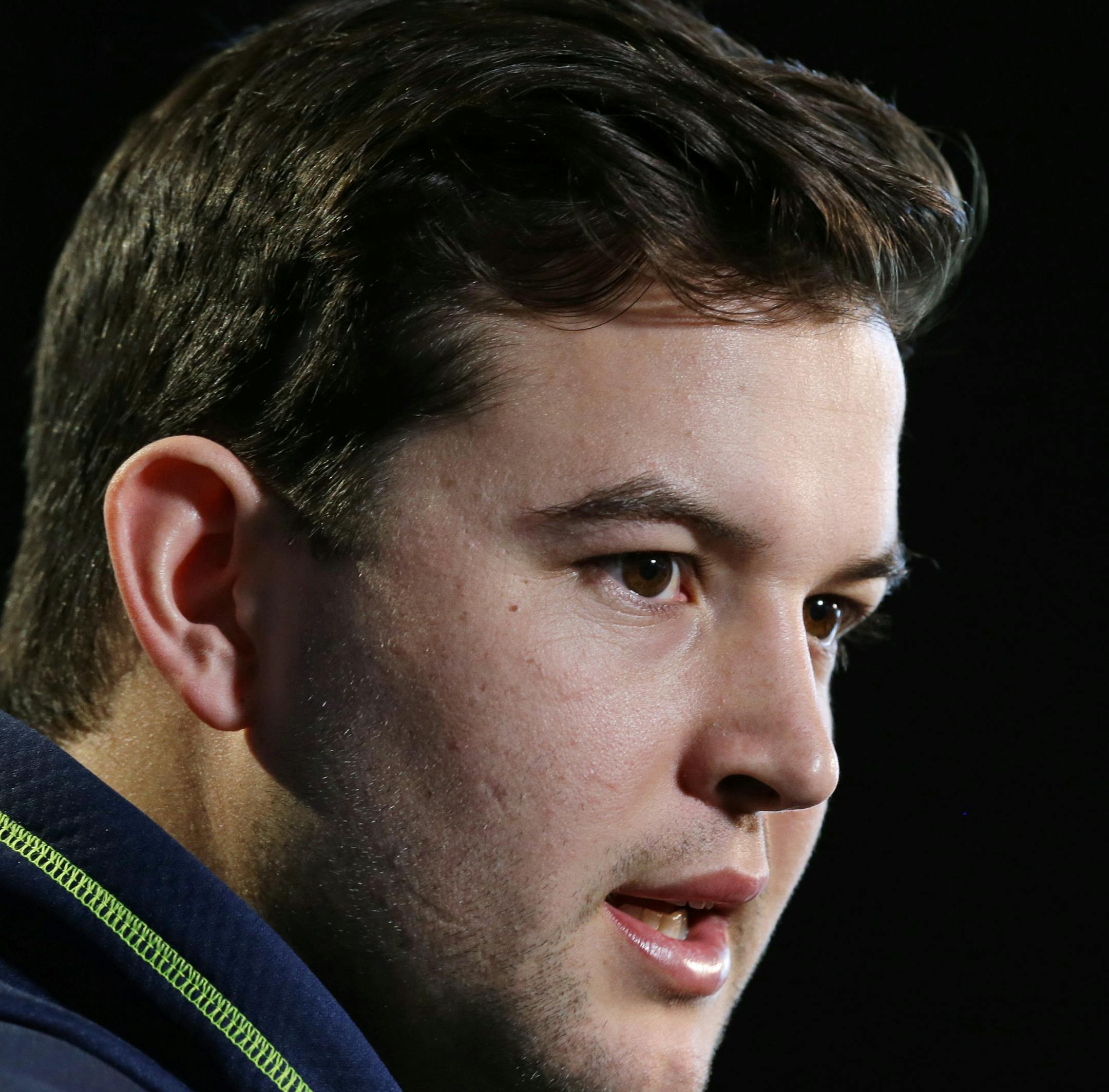 Alabama quarterback AJ McCarron answers a question during a news conference at the NFL football scouting combine in Indianapolis, Friday, Feb. 21, 2014. (AP Photo/Michael Conroy)