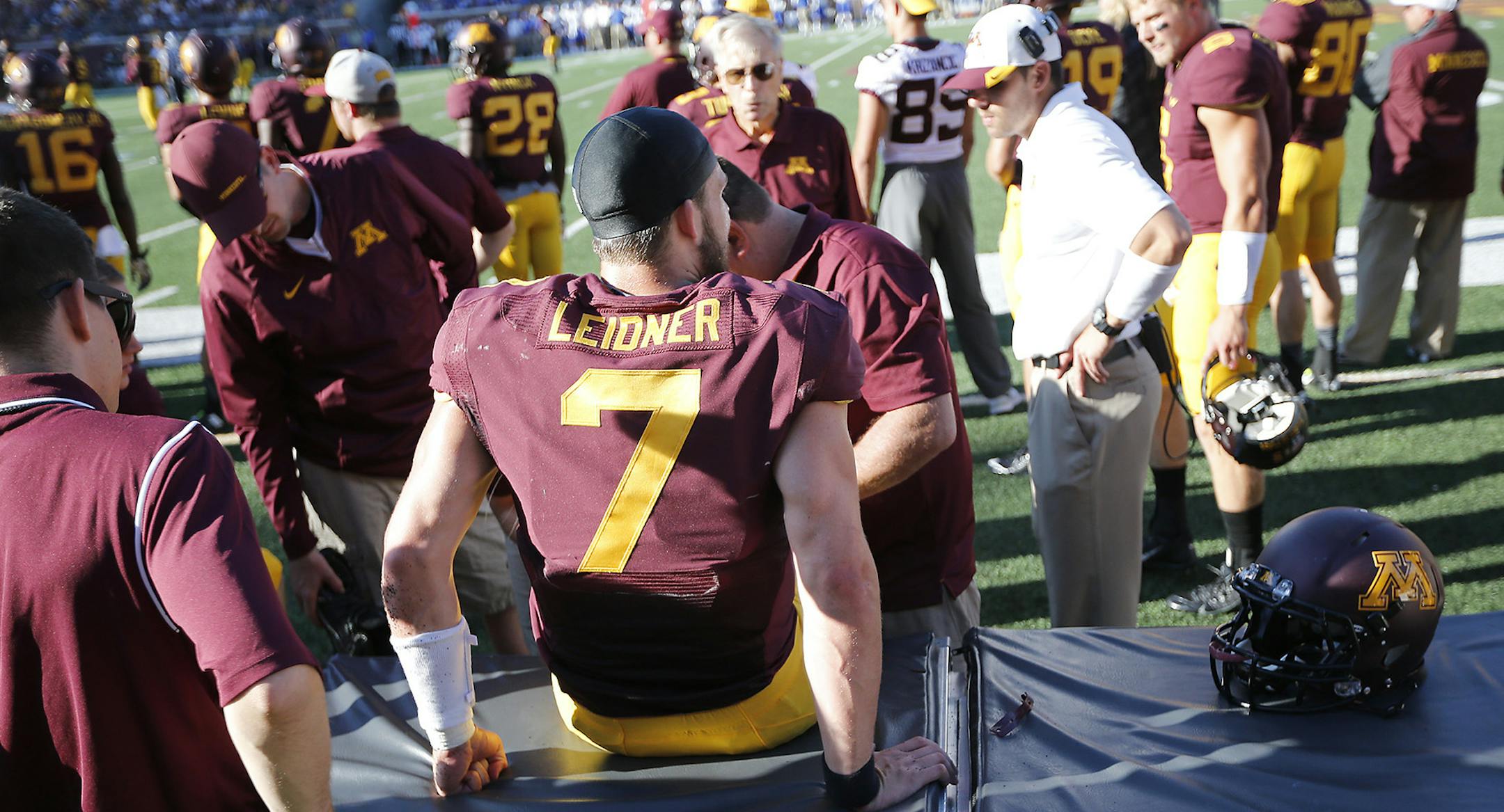 Minnesota staff worked on Minnesota sophomore quarterback Mitch Leidner's knee injury in the third quarter as the Minnesota Gophers took on Middle Tennessee at TCF Bank Stadium, Saturday, September 6, 2014 in Minneapolis, MN. ] (ELIZABETH FLORES/STAR TRIBUNE) ELIZABETH FLORES &#x2022; eflores@startribune.com