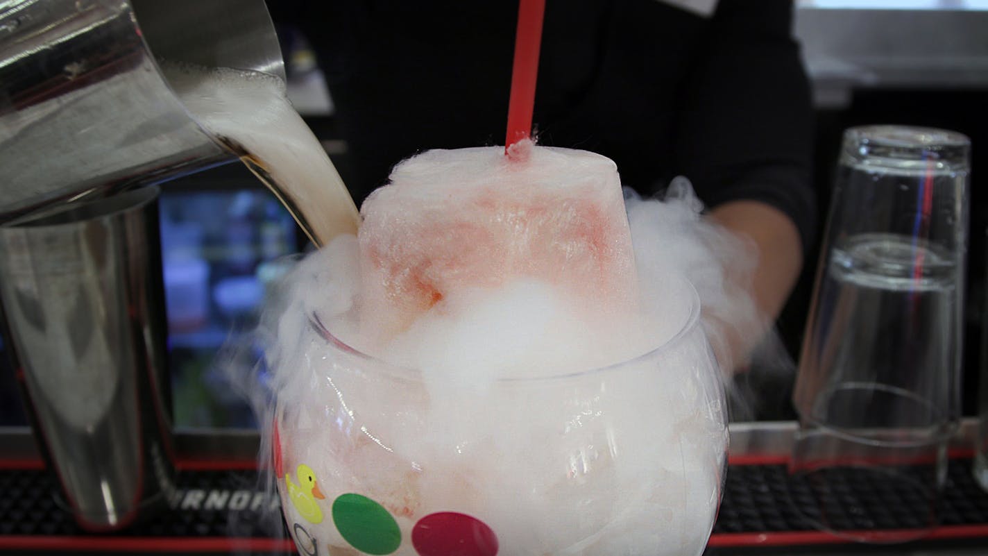 Outta Control: The Sugar Factory in the Mall of America.The Drake contains a stick of strawberry lemonade cotton candy that melts into the peachy tea and whiskey drink as smoke from the dry ice consumes it. Friday, Dec. 20, 2019, Bloomington, MN. ] Matt Gillmer / matt.gillmer@startribune.com