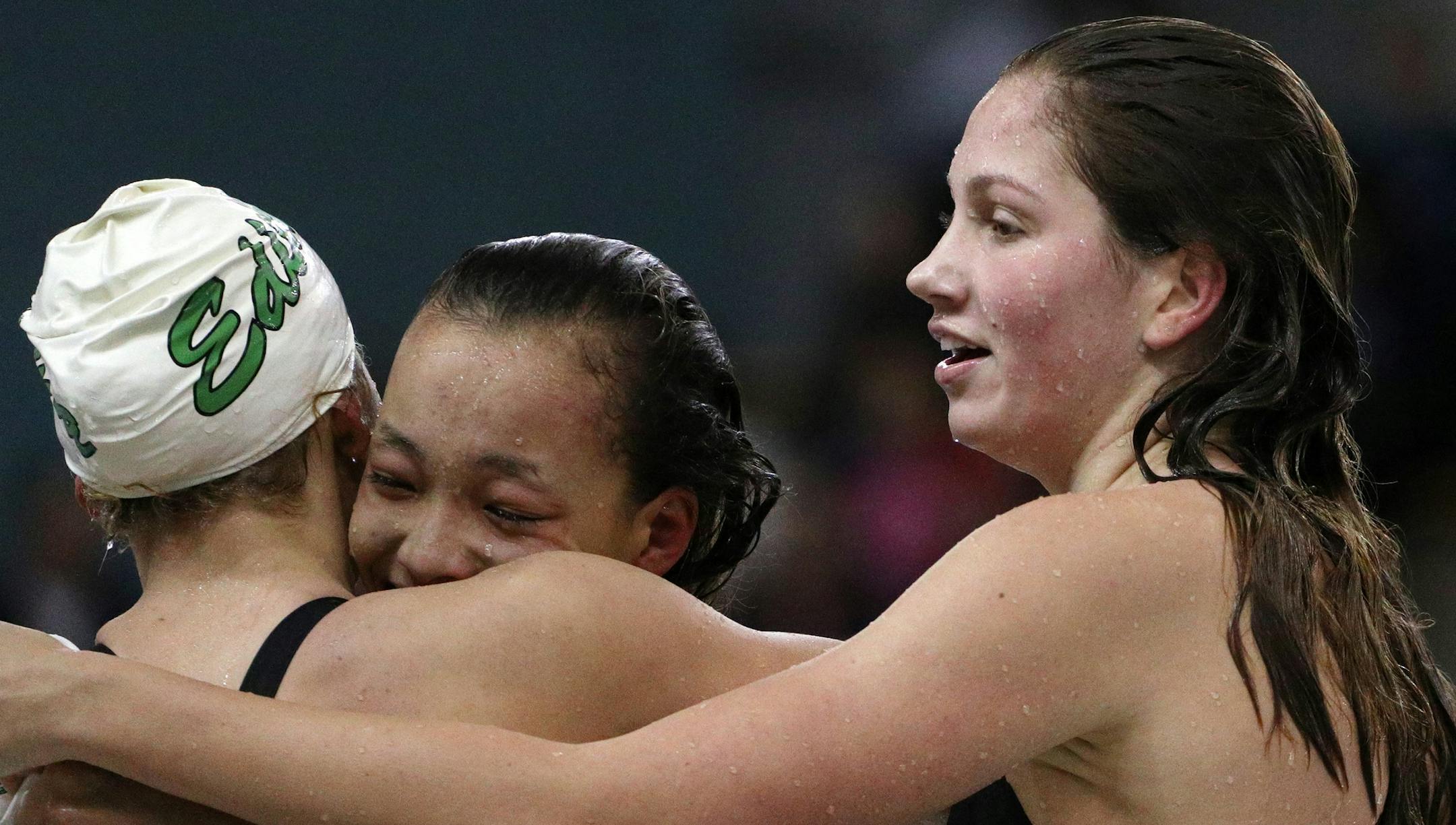 Kelli McCarthy, right, of Edina hugged her teammates after the 200 yard freestyle. ] ANTHONY SOUFFLE ï anthony.souffle@startribune.com Action from a Class 2A girls' swimming state meet finals Saturday, Nov. 18, 2017 at the Jean K Freeman Aquatic Center on the grounds of the University of Minnesota in Minneapolis.