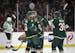 Minnesota Wild left wing Zach Parise (11) was congratulated by his linemates, including Minnesota Wild center Mikko Koivu (9) and defenseman Nick Seel