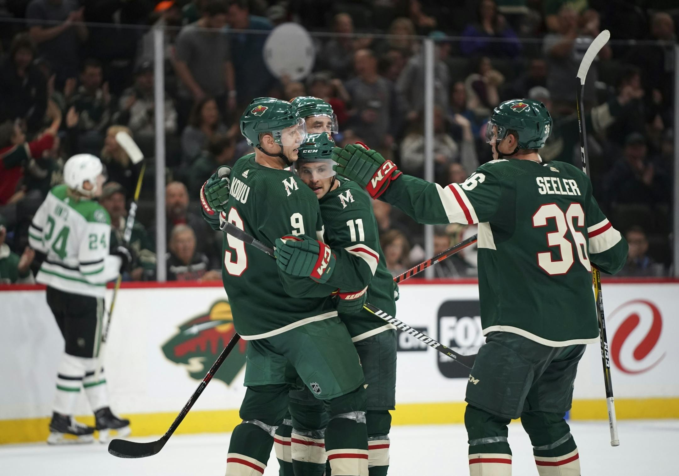 Minnesota Wild left wing Zach Parise (11) was congratulated by his linemates, including Minnesota Wild center Mikko Koivu (9) and defenseman Nick Seeler (36) after scoring a goal last season.