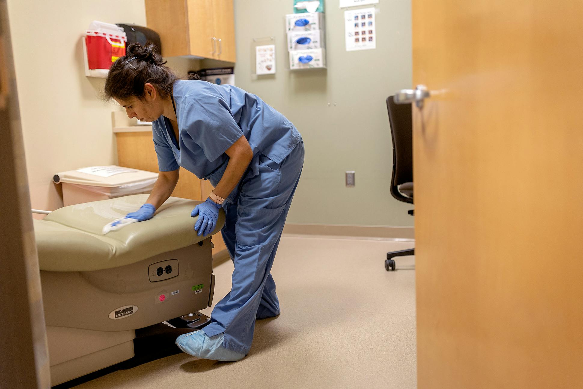 A staffer cleans examining rooms at Planned Parenthood in St. Paul, Minn., on Wednesday, May 24, 2023.