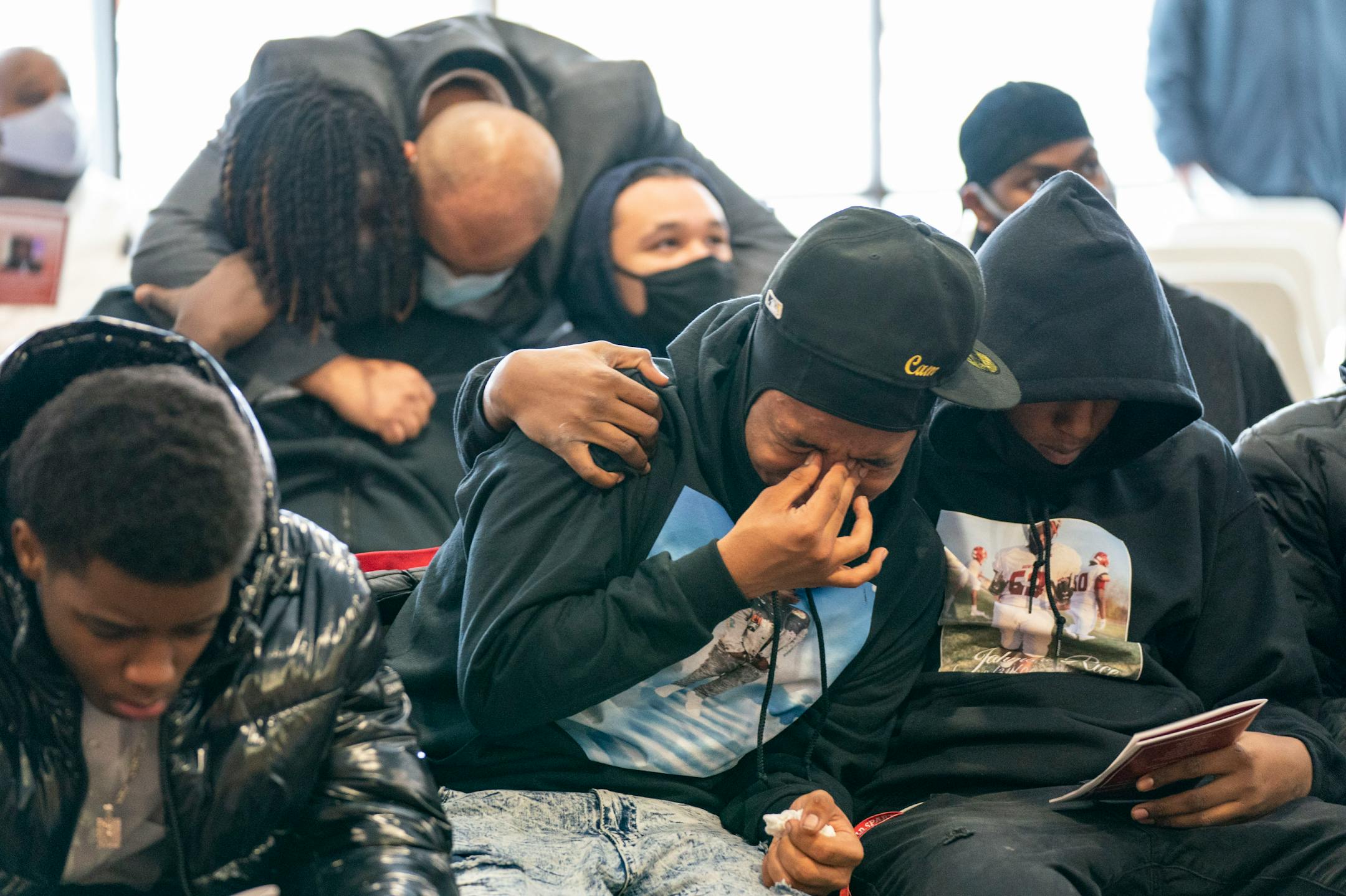 Cam Harper, a friend of Jahmari Rice, cries at his funeral Wednesday, Feb. 9, 2022 at Hope Presbyterian Church in Richfield.