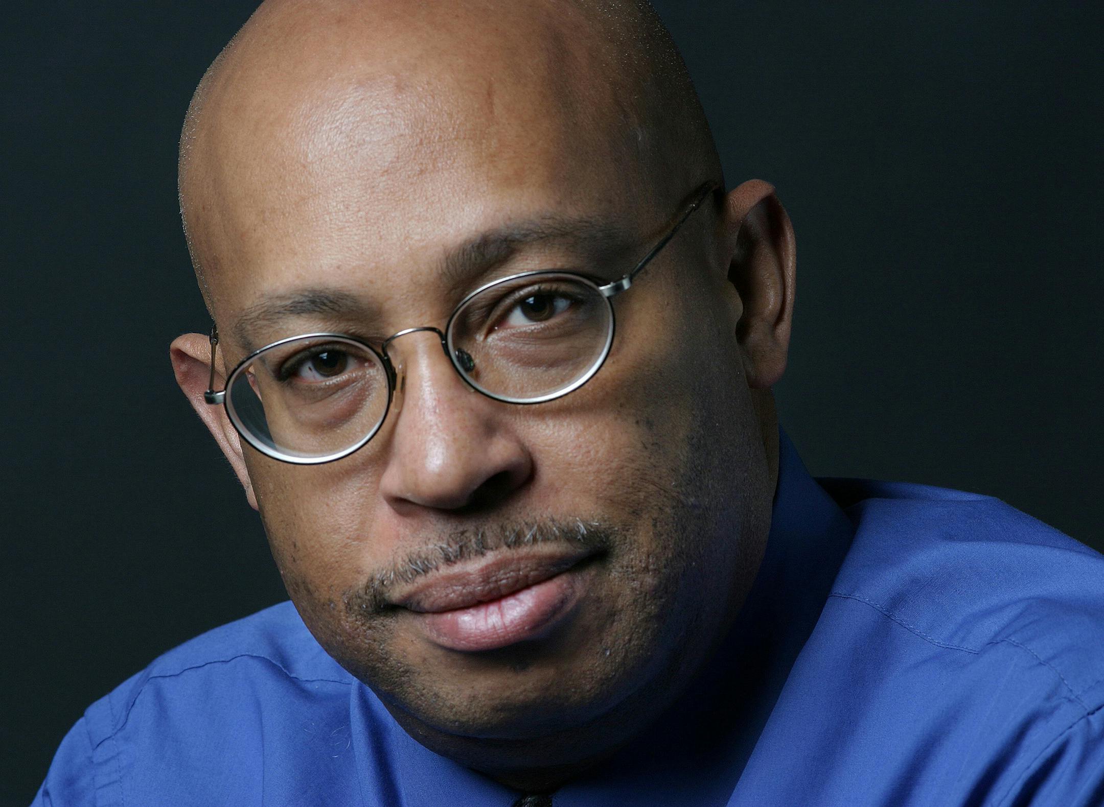 This April 15, 2004 photo shows Michel du Cille, a photographer and former photo editor with The Washington Post. Three time Pulitzer Prize winner, du Cille died Thursday Dec. 11, 2014 while on assignment chronicling Ebola patients and their caretakers for the Post in Liberia. He was 58. (AP Photo/The Washington Post, Julia Ewan)