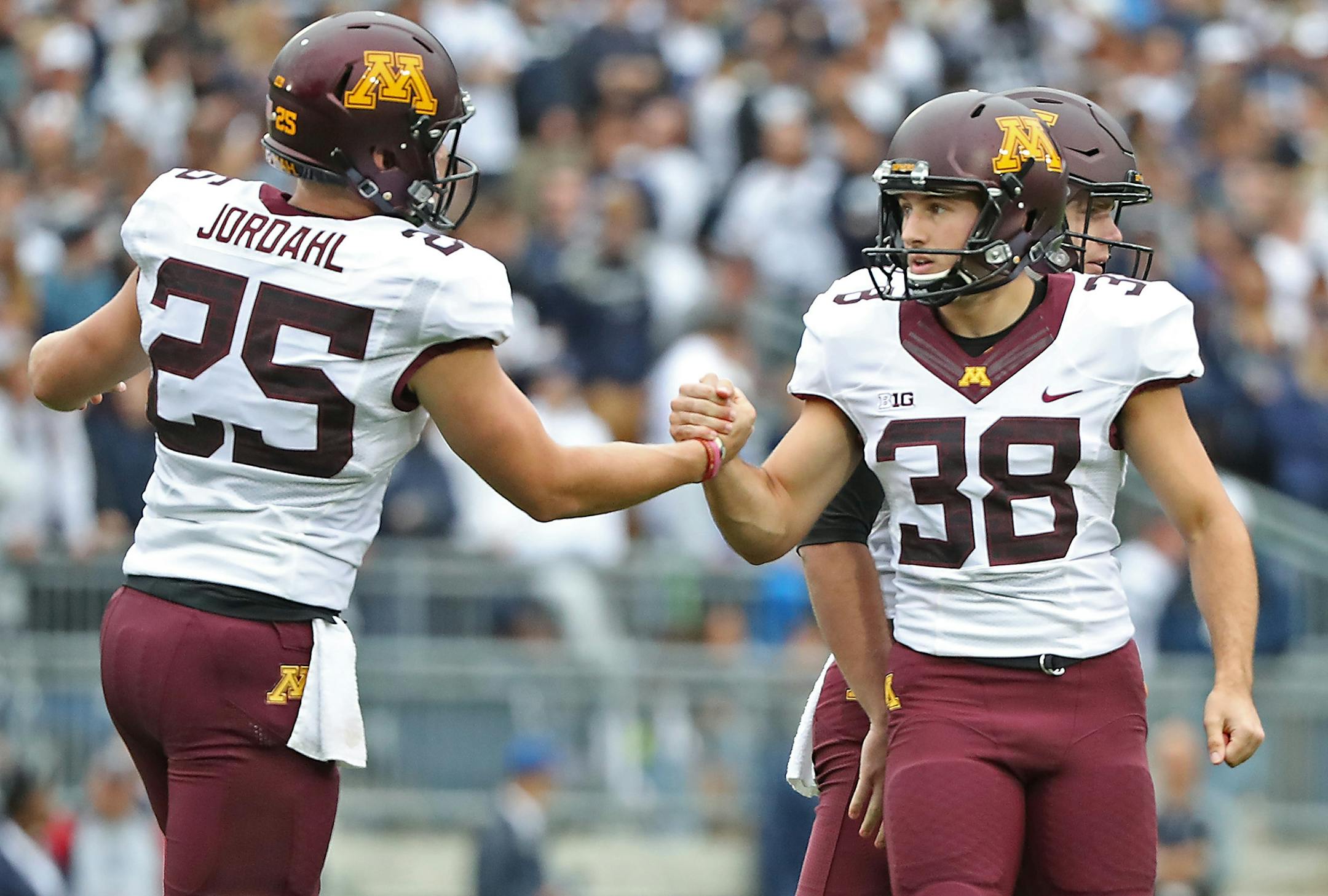 Minnesota's place kicker Emmit Carpenter celebrated his 37-yard field goal for three points with teammate long snapper Payton Jordahl in the first quarter as Minnesota took on Penn State at Beaver Stadium, Saturday, October 1, 2016 in State College, PA.