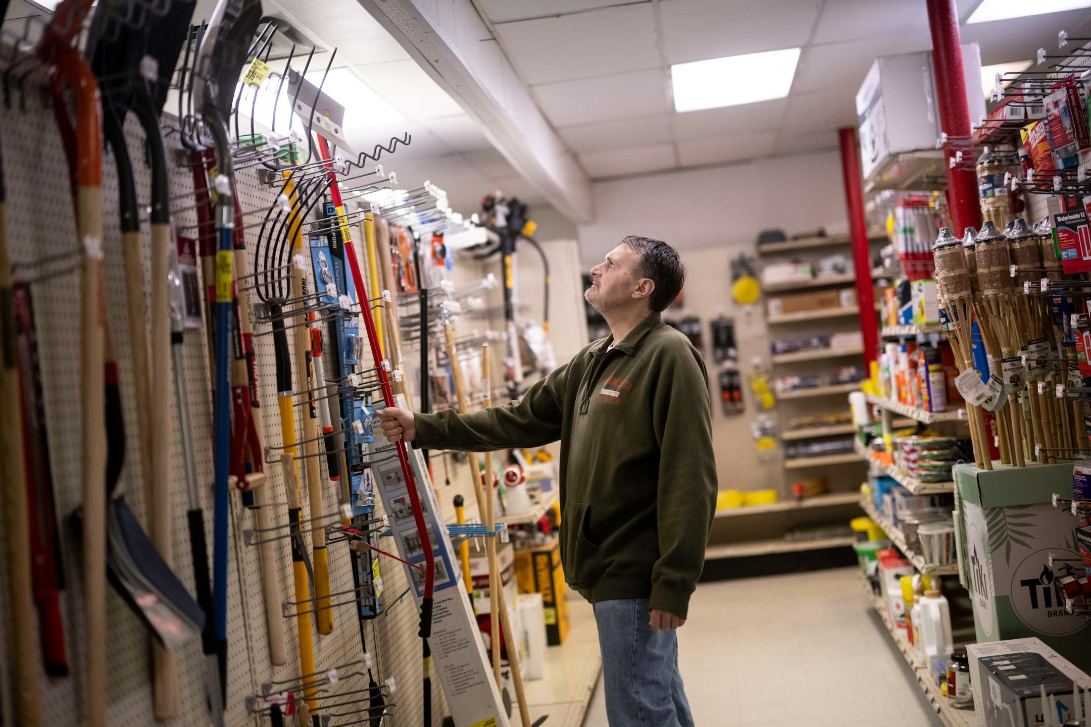 Tim Hauser, of New Prague, browses yard equipment at Lonsdale Hardware and Rental.