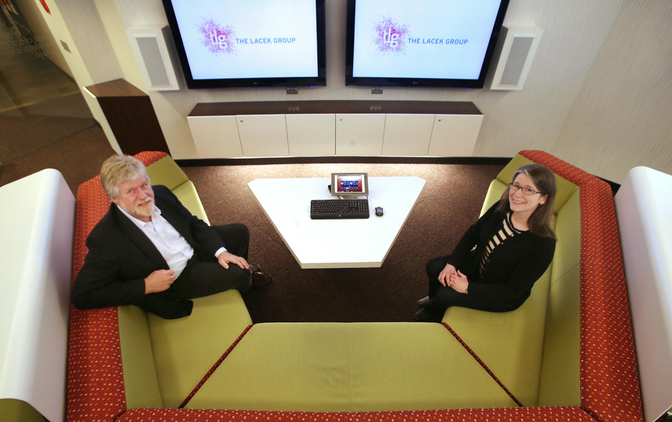 Dan Knudsen and Julie Bustos of The Lacek Group in Minneapolis, MN. ] JOELKOYAMA‚Ä¢jkoyama@startribune Minneapolis, MN on May 7, 2014.