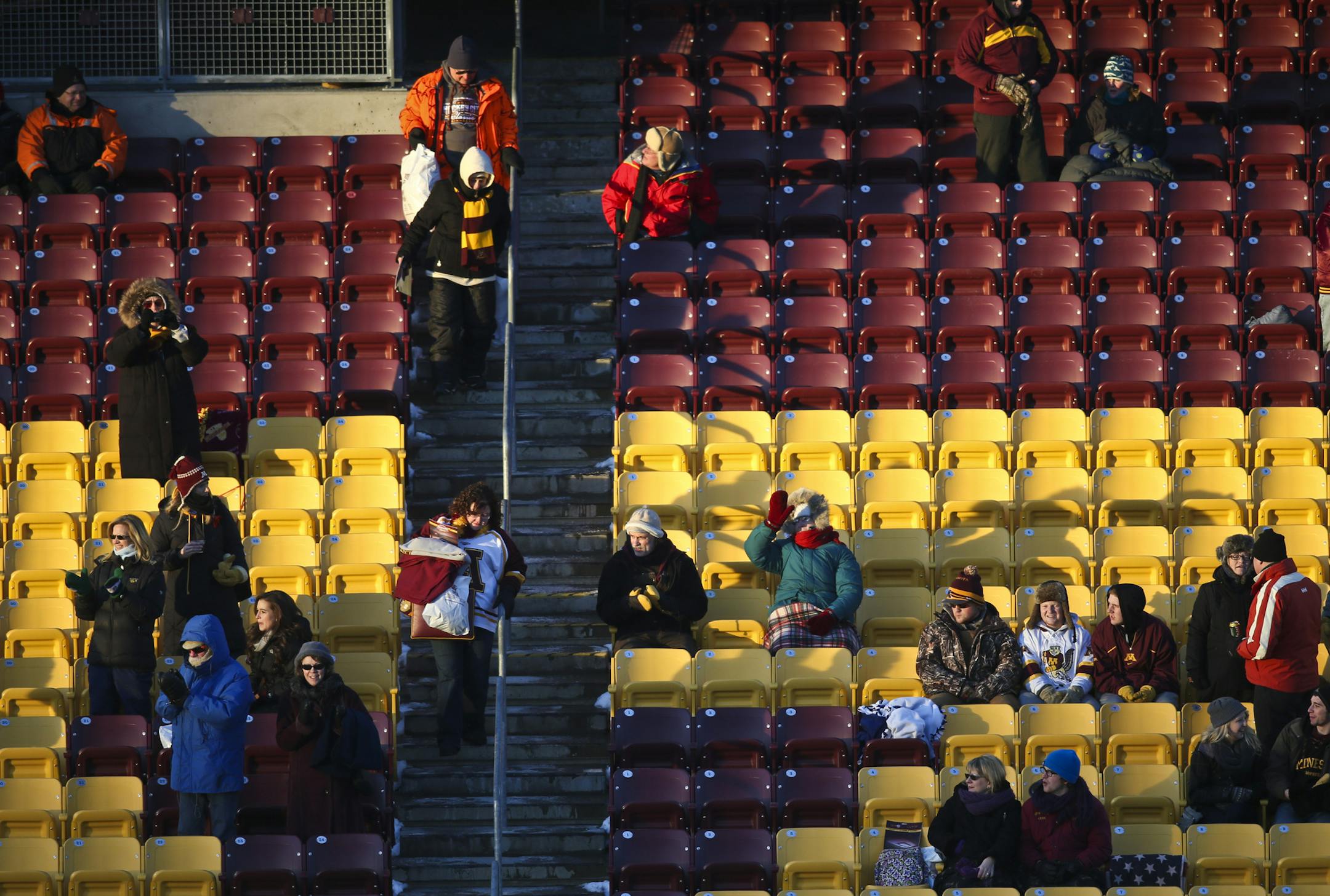 Crowds tried to stay warm during the Minnesota Gophers women's hockey vs. Minnesota State, Mankato Hockey CIty Classic game at TCF Bank Stadium on Friday, January 17, 2014. ] (RENEE JONES SCHNEIDER reneejones@startribune.com)