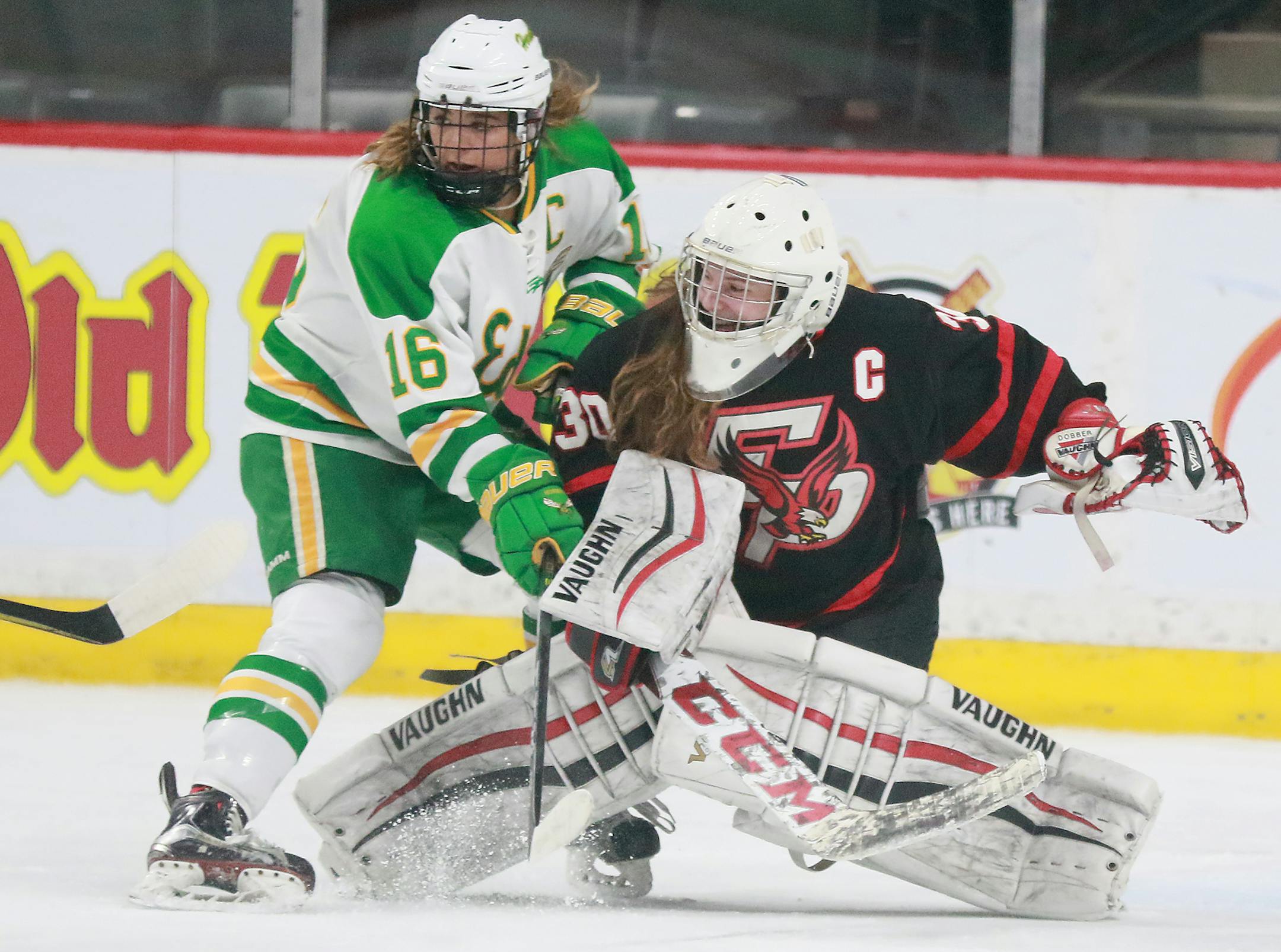 Eden Prairie goalie Crystalyn Hengler (13) jostles with Edina's Emily Oden (16) during the first period of the Class 2A girls' hockey state tournament semifinals Friday, Feb. 23, 2018, at Xcel Energy Center in St. Paul, MN.] DAVID JOLES ï david.joles@startribune.com Class 2A girls' hockey state tournament semifinals