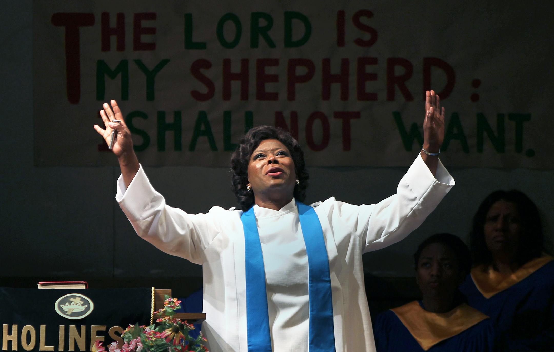 Singing actor Greta Oglesby during church. ___ Singing actor Greta Oglesby stars as pastor Margaret Anderson in James Baldwin's "The Amen Corner," directed by Lou Bellamy in a Penumbra Theatre production at the Guthrie Theater. The cast includes Eric Berryman (David Alexander), Shá Cage (Sister Sally), Lerea Carter (Ida Jackson), James Craven (Brother Washington), Crystal Fox (Odessa), Hannibal Lokumbe (Luke), Thomasina Petrus (Sister Boxer), Faye M. Price (Sister Douglass), Dennis W. Spears (Br