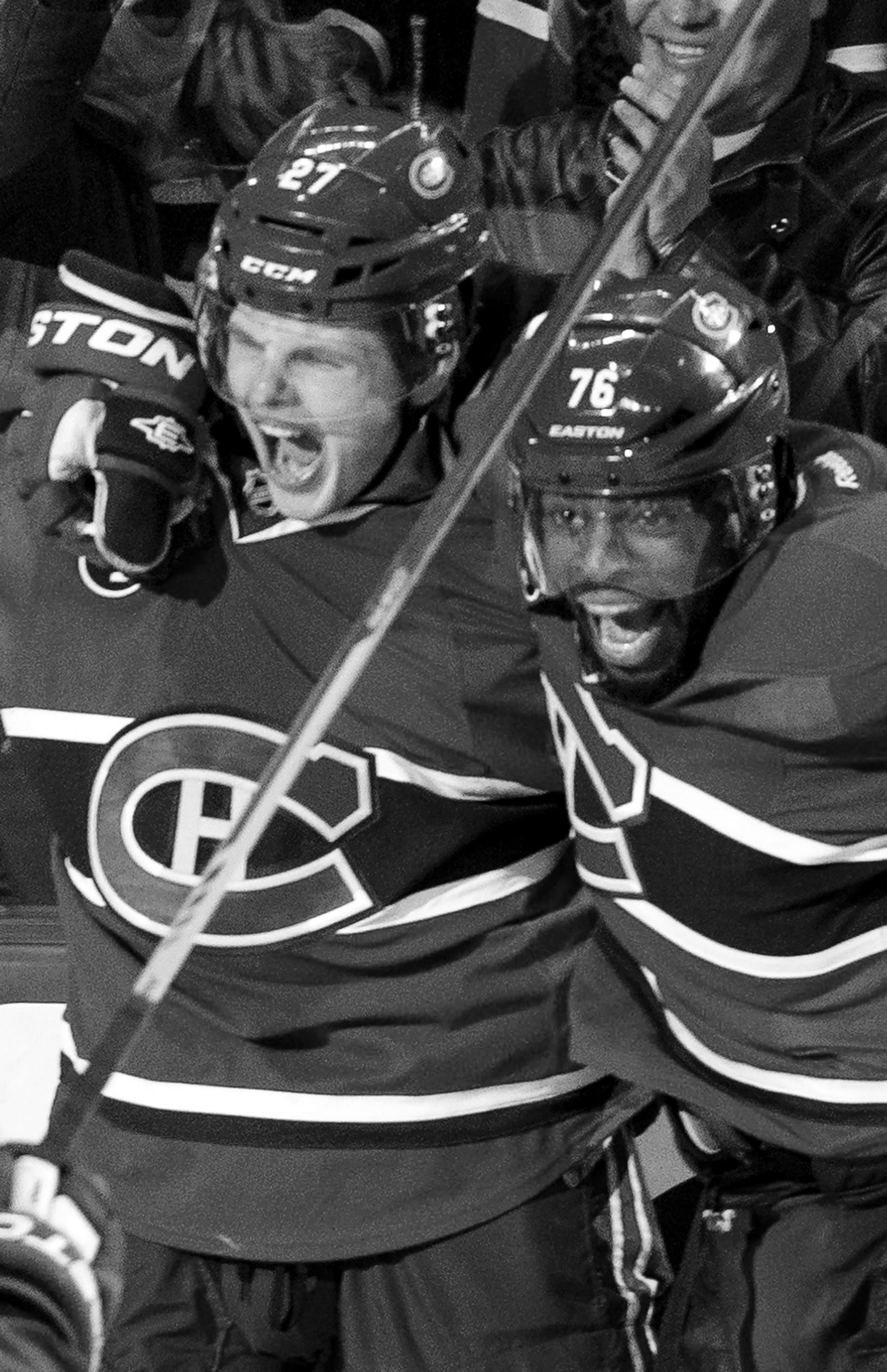 Montreal Canadiens' Alex Galchenyuk, left, celebrates his winning goal over the Ottawa Senators with teammate P.K. Subban during first period overtime in Game 2 of an NHL hockey first-round playoff series, Friday, April 17, 2015 in Montreal. (Paul Chiasson/The Canadian Press via AP) MANDATORY CREDIT