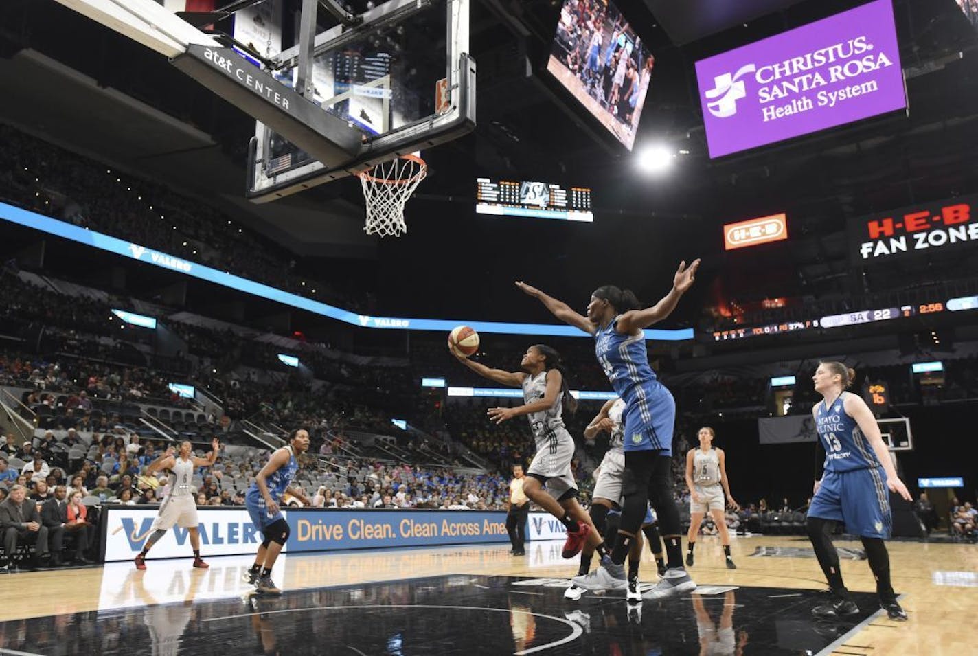 San Antonio Stars' Moriah Jefferson, center, shoots against the Minnesota Lynx during a WNBA basketball game in the AT&T Center, Tuesday, July 12, 2016, in San Antonio. The Lynx won 81-57.