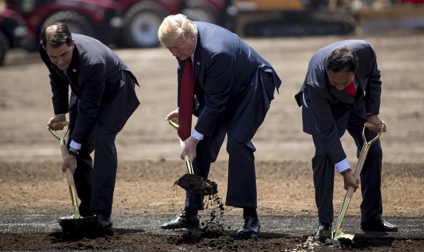 Wisconsin Gov. Scott Walker, President Donald Trump and Foxconn chairman Terry Gou at a groundbreaking for the Foxconn plant Thursday, June 28, 2018 in Mt. Pleasant, Wis.