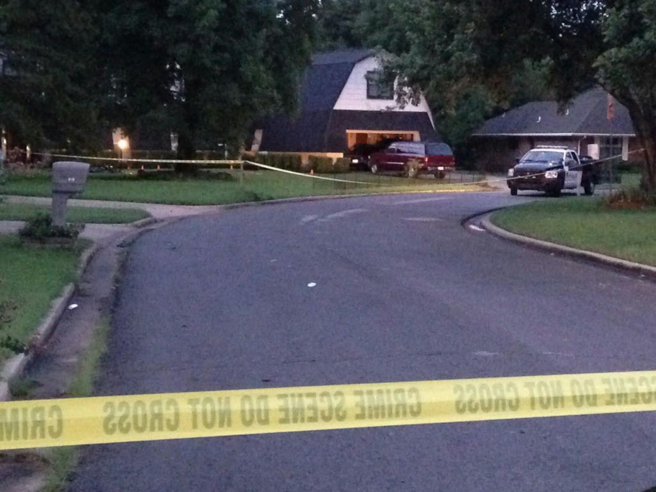 Crime scene tape marks off the area as police investigate scene, Thursday morning, July 23, 2015, in Broken Arrow, Okla., where authorities say five people were found dead late Wednesday night. Police say a 16-year-old and an 18-year-old, who are both related to the victims, were taken into custody. (AP Photo/Justin Juozapavicius