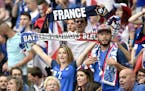 France supporters hold scarfs on the stands wait for the Euro 2016 Group A soccer match between France and Romania, at the Stade de France, in Saint-D
