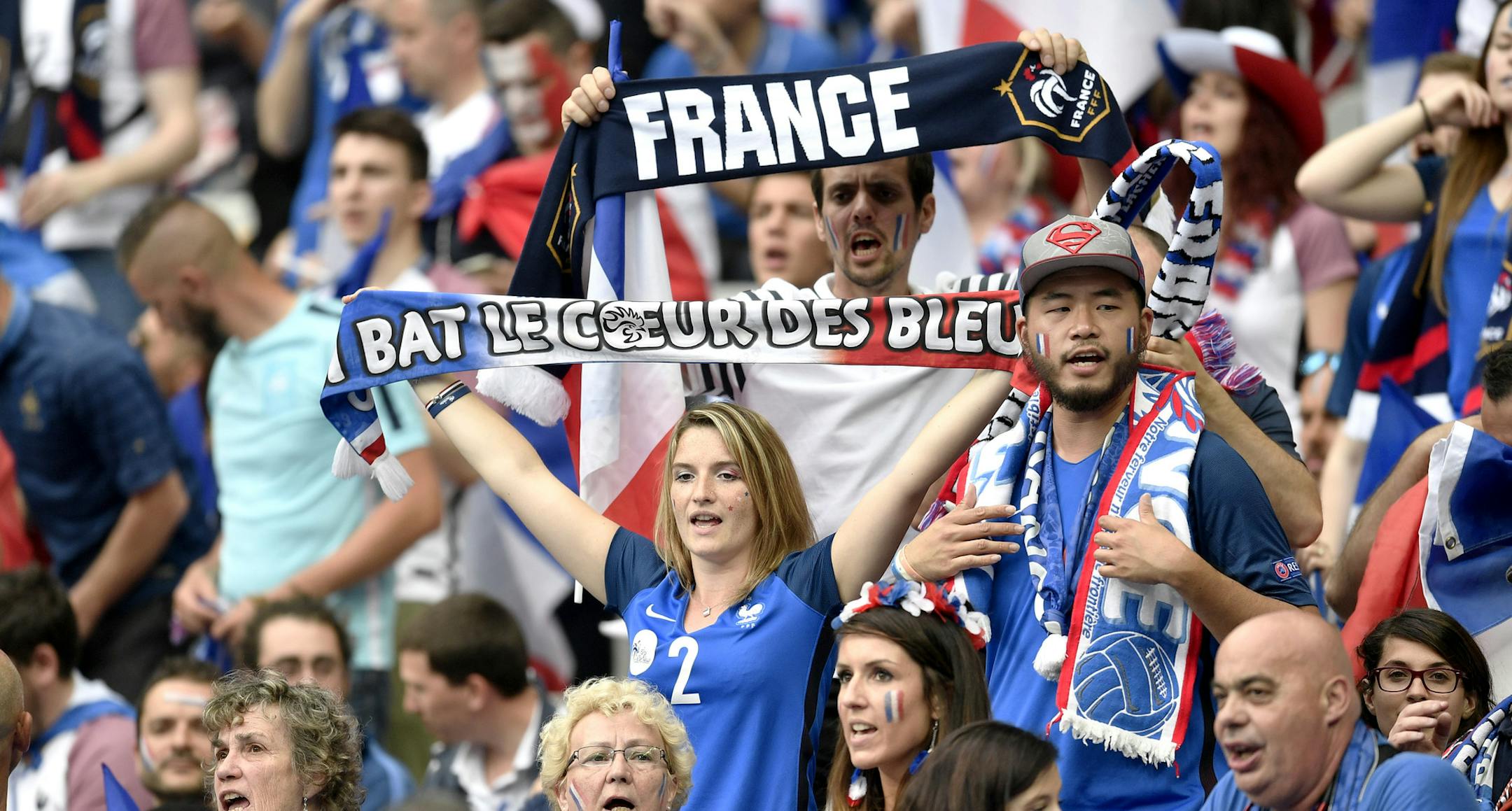 France supporters hold scarfs on the stands wait for the Euro 2016 Group A soccer match between France and Romania, at the Stade de France, in Saint-Denis, north of Paris, Friday, June 10, 2016. (AP Photo/Martin Meissner)